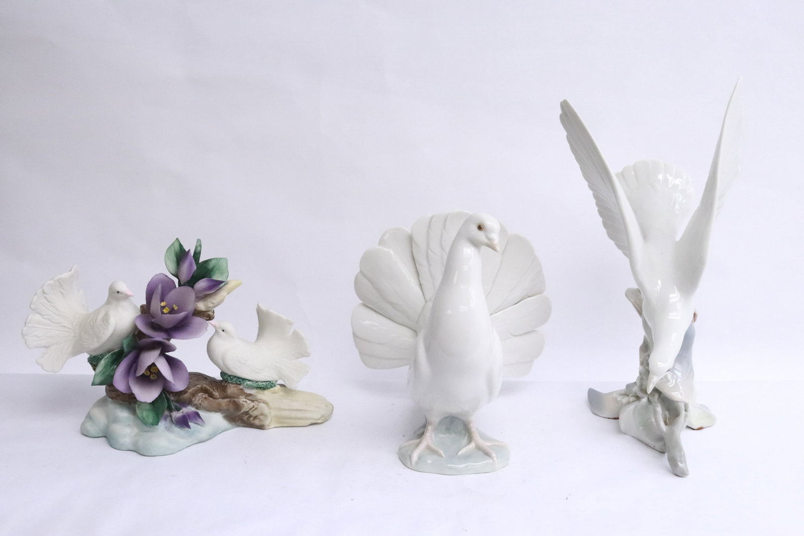 2 Ildro birds, and a bisque bird group: 3 items; 2 Ildro birds (7.8"H, 11.4"H), and a bisque bird group (6.2"H)