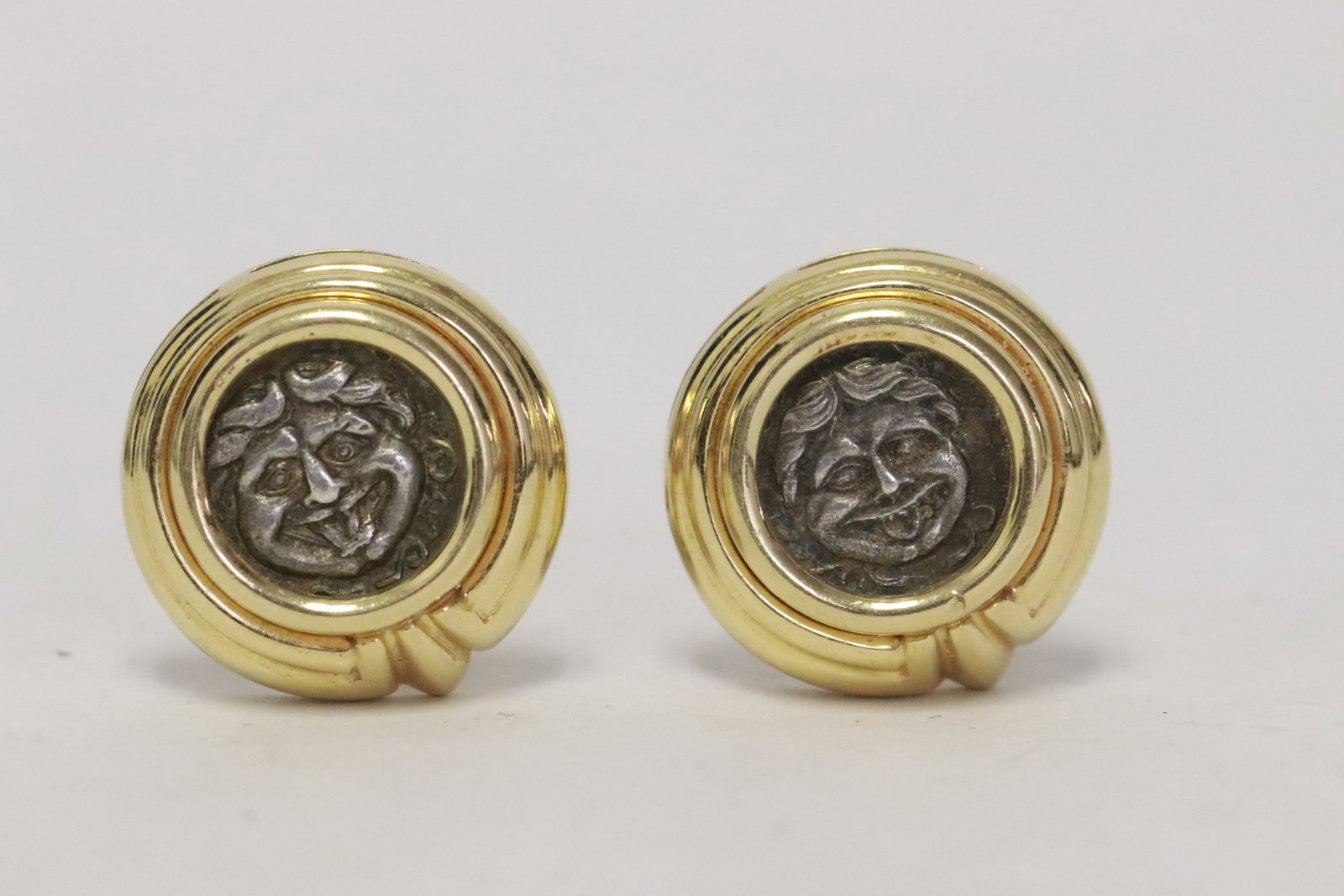 Pair 18K Y/G earrings w/ ancient coin by Bulgari: Pair 18K Y/G earrings (0.75"dia ea) with ancient coin dated 4th century B.C. by Bulgari, wt. 24.5gm