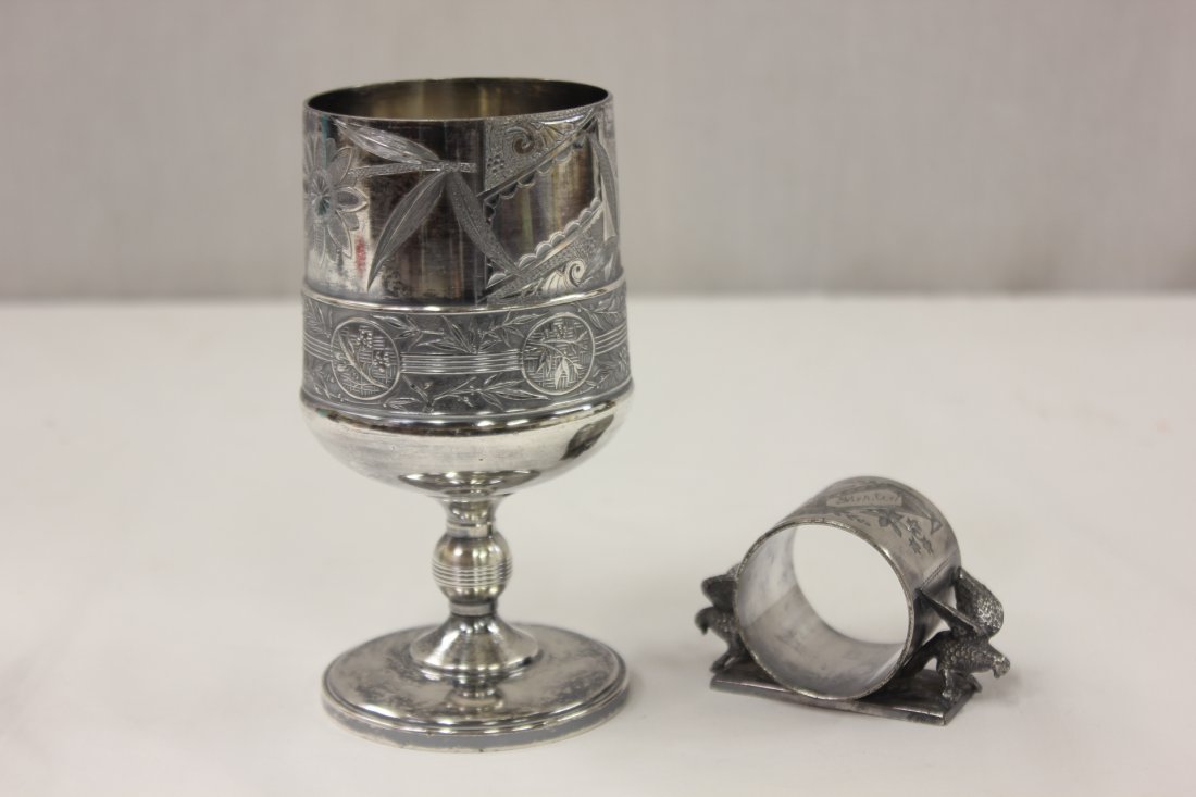 Victorian s/p Pairpoint goblet & a s/p napkin ring: Victorian silverplate goblet (5.8"Hx3"dia) by Pairpoint, and a silverplate napkin ring (2"Hx3.2"x1.6") decorated with eagles