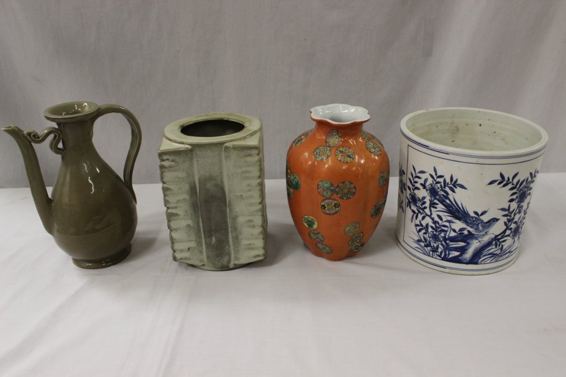 4 porcelain pieces: A blue and white porcelain brush pot (7.05"Hx7.5"dia), a green glazed wine server (8.8"Hx7"x4"), a famille rose vase (8.2"Hx5.25"dia) and a square zong form vase (7.5"Hx5.2"x5.2")