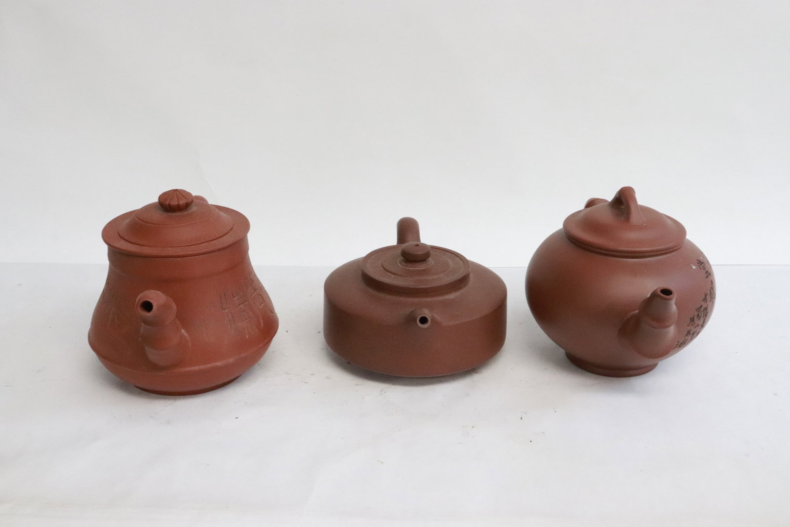 3 Yixing teapots: 3 Yixing teapots, 2.8"x6.35"x4.35" - 4.35"x6.85"x4.35"