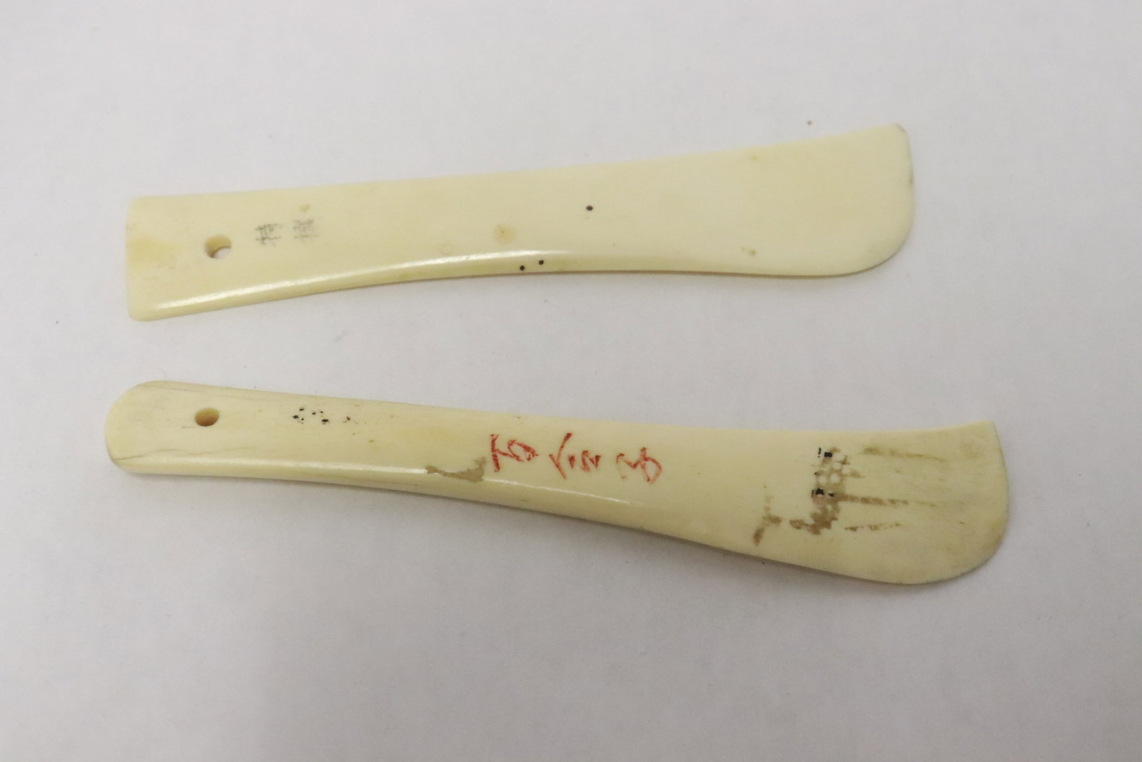 2 bone carved medicine scoops: 2 bone carved medicine scoops, 4.7"L, 4.85"L