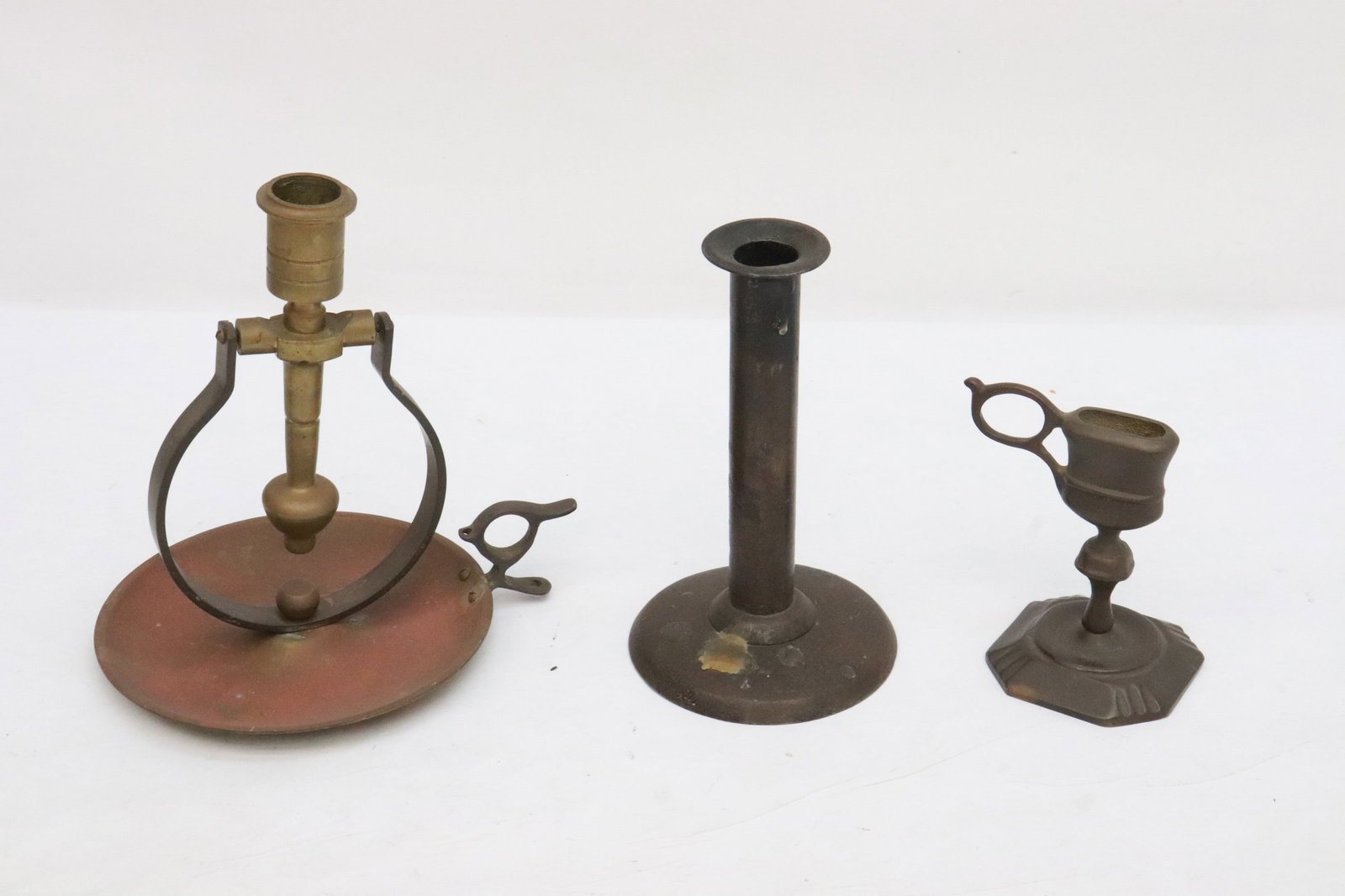 3 Victorian copper/ bronze candle holders: 3 Victorian copper/ bronze candle holders (4.2"H - 7.2"H); including one possible for ocean ship