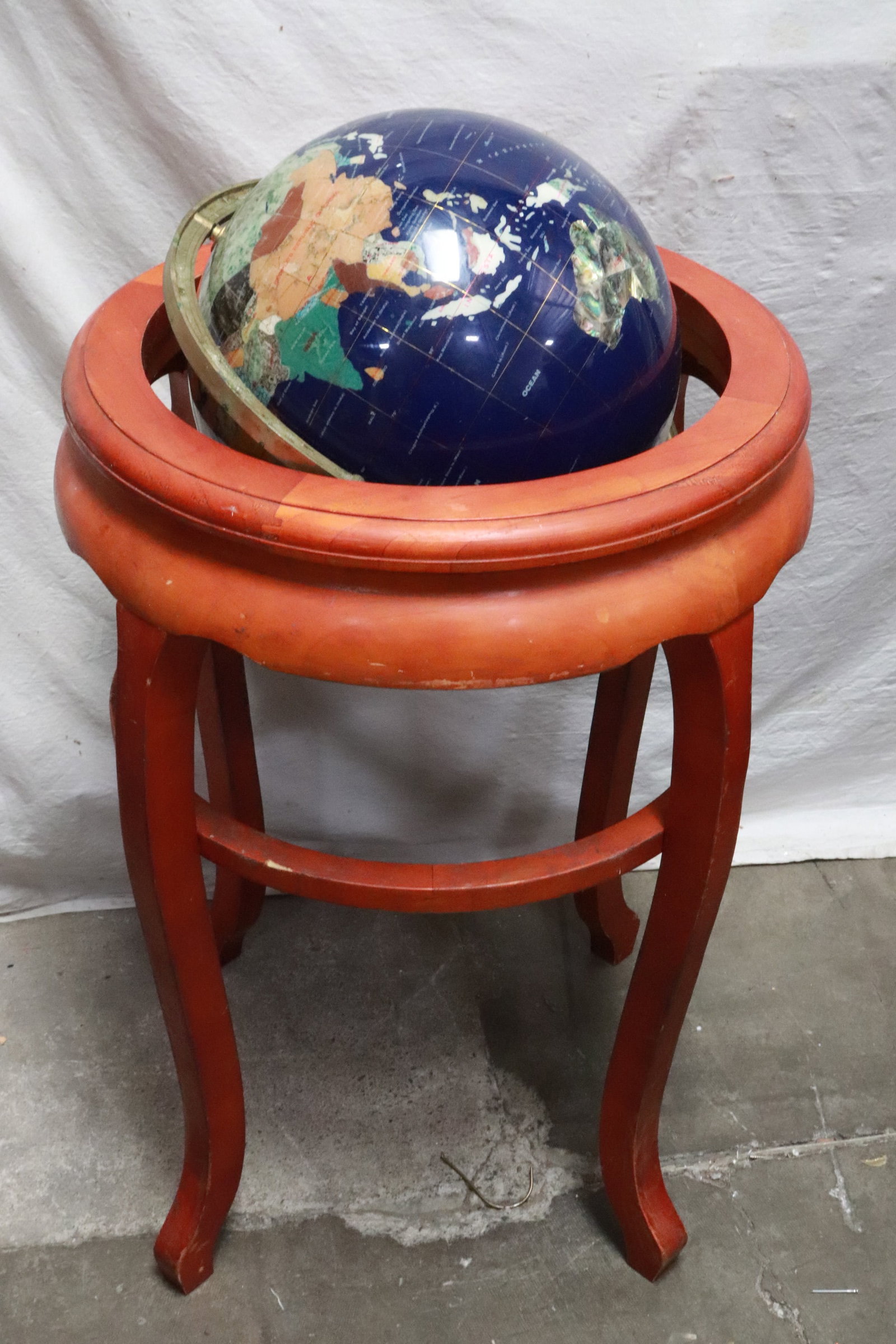 A floor globe with wood pedestal stand: A floor globe with wood pedestal stand, 33.7"x21.85"dia