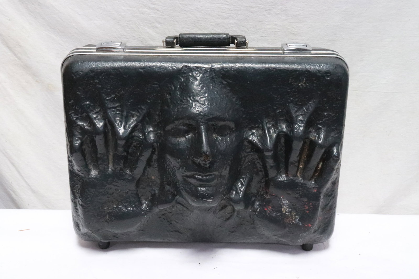artist designed suitcase, signed: A very unusual artist designed suitcase with human face motif decoration in high relief, signed on the other side of suitcase, 14.3"x18"x8.9"