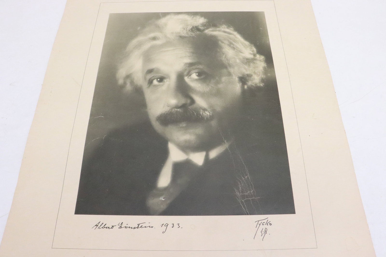 Photo print of Albert Einstein by Aaron Tycko: Photo print of Albert Einstein by Aaron Tycko, tear on bottom, scratch on surface, 20.5"x16"