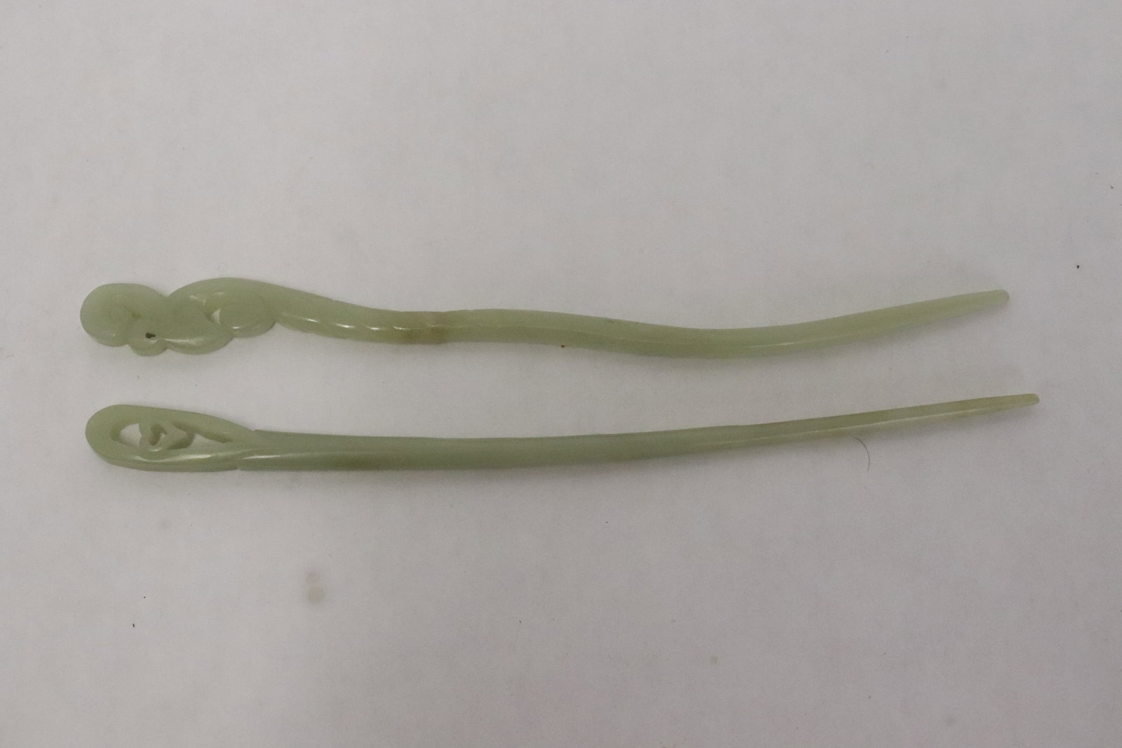 2 Chinese celadon jade hairpins: 2 Chinese celadon jade hairpins, 7"L, 7.05"L