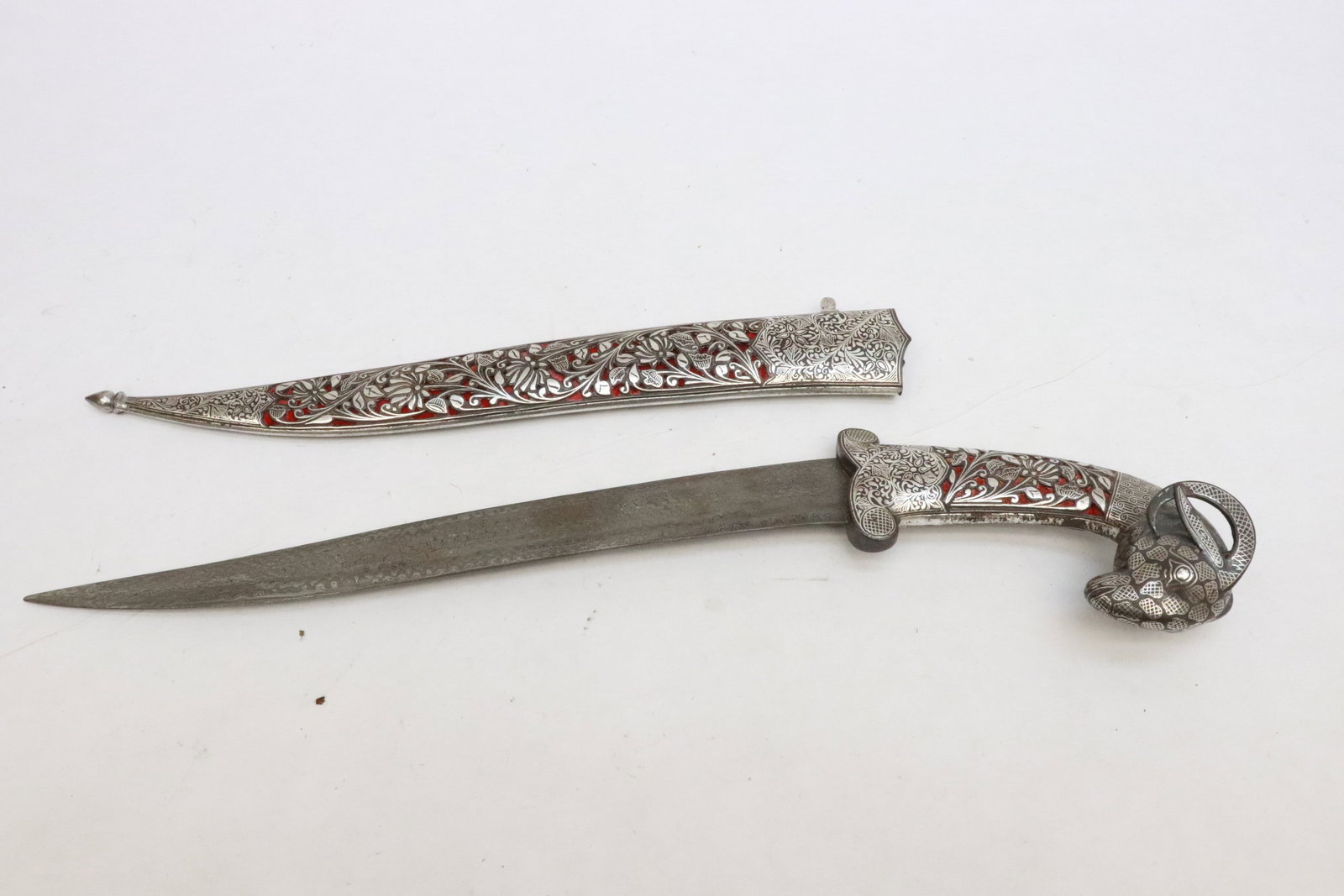 A dagger w/ inlaid blade & ram head motif handle (1 of 8)
