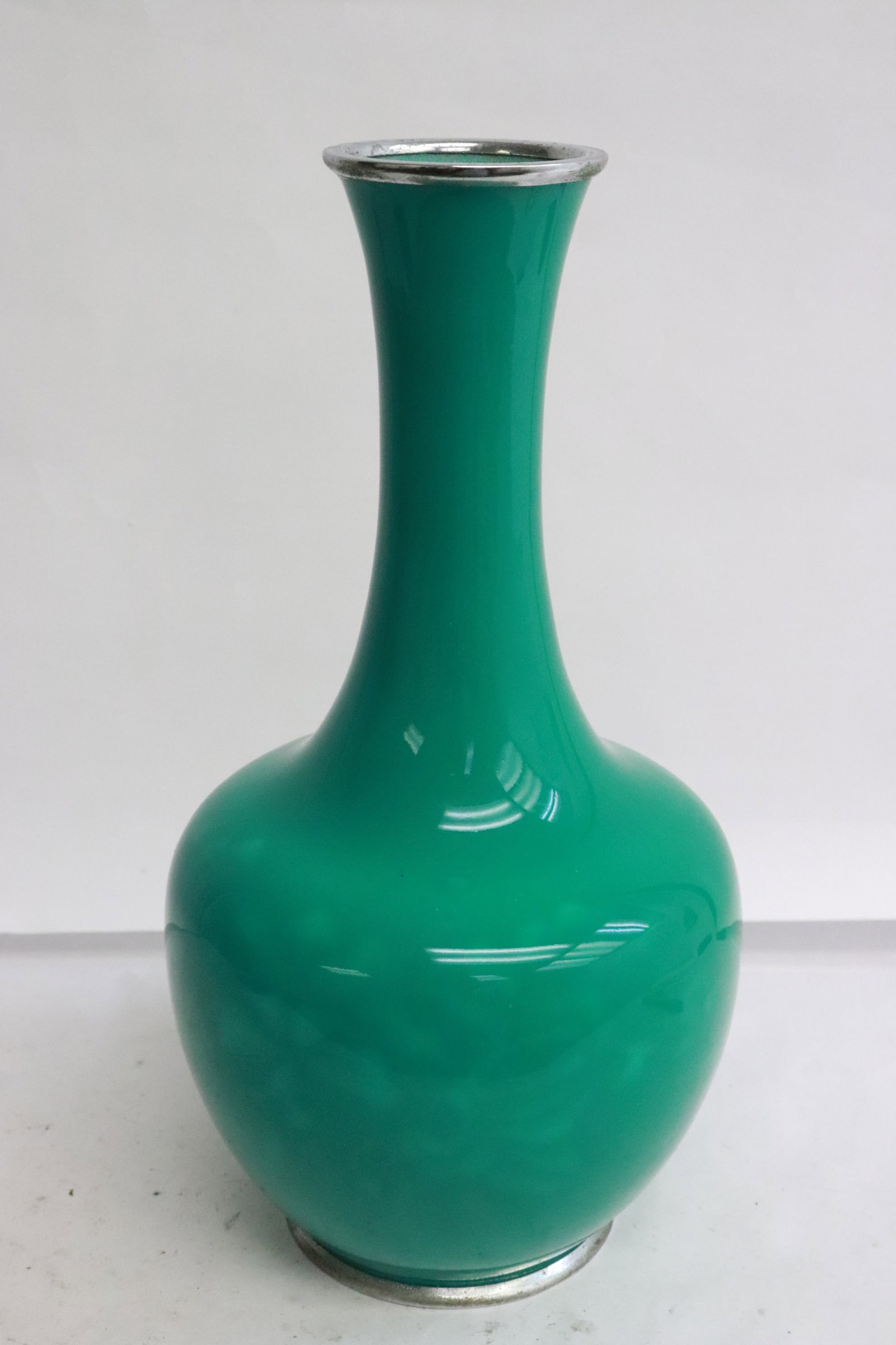 A green cloisonne vase: A green cloisonne vase, 9.65"x5.15"dia