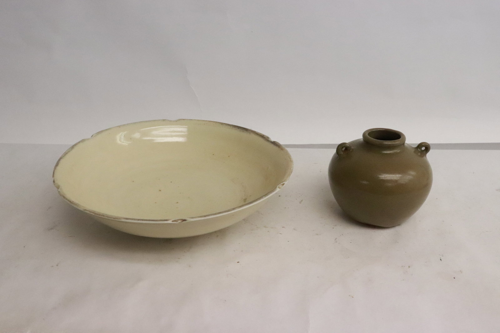 a Ming water dripper, & a Song porcelain bowl: 2 pieces; a Ming green glazed water dripper (3"x3.5"dia), and a Song white porcelain bowl (top edge chips) (2.2"x7.5"dia)