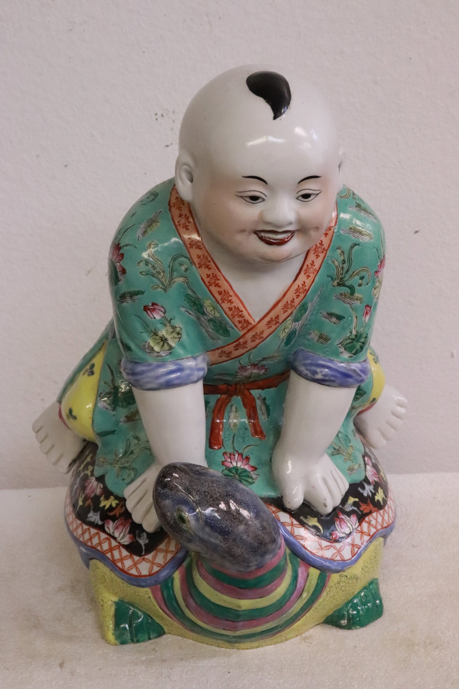 Chinese porcelain sculpture: Chinese porcelain sculpture depicting boy riding on turtle, 15.4"H