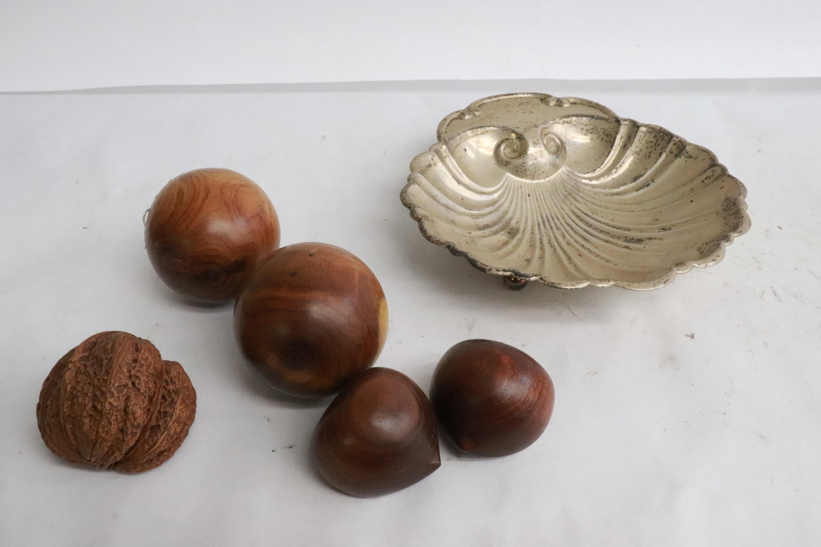 4 huanghuali wood pieces, and a natural nut: 5 items; 2 huanghuali wood balls (2.1"x2.1"dia ea), 2 huanghuali wood pear shape ornaments (1.3"x1.5"x1.5" ea), and a natural nut