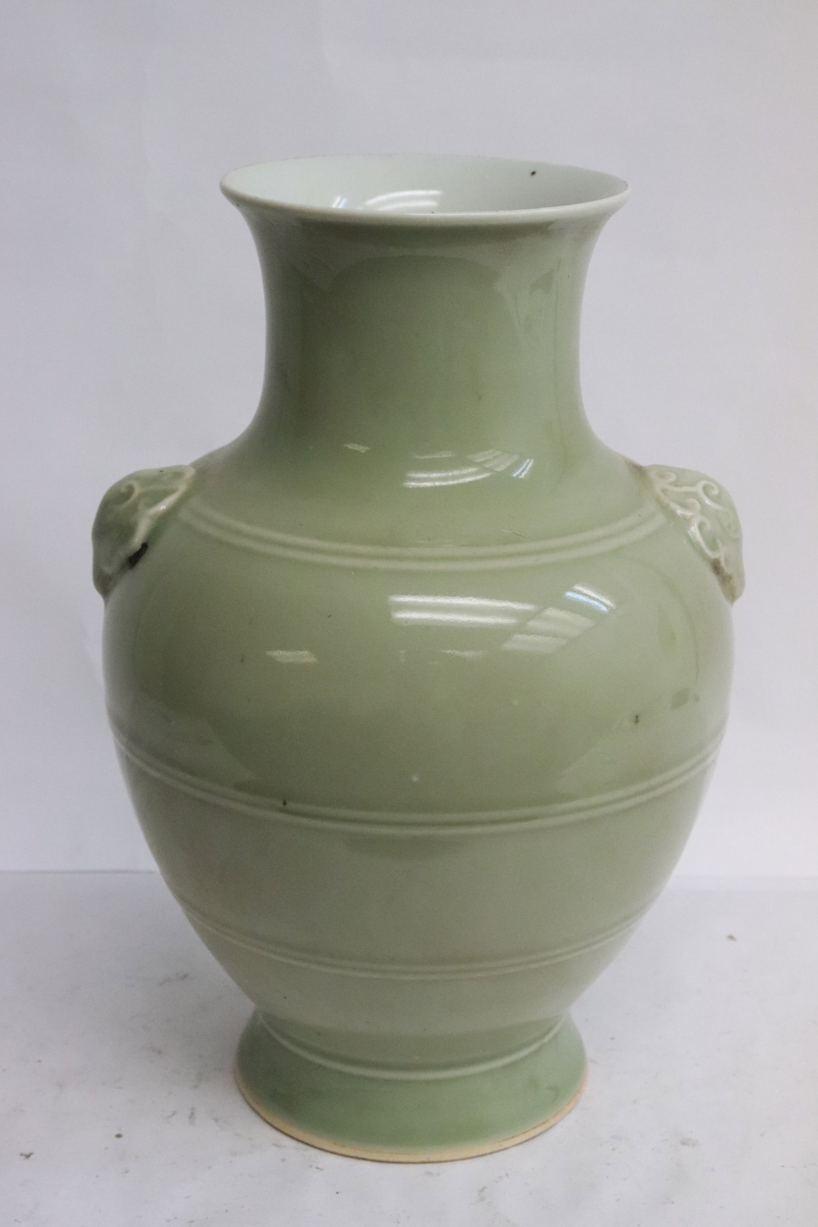 Celadon porcelain vase with ram motif handles: Celadon porcelain vase with ram motif handles, 10.2"x7"x6.85"