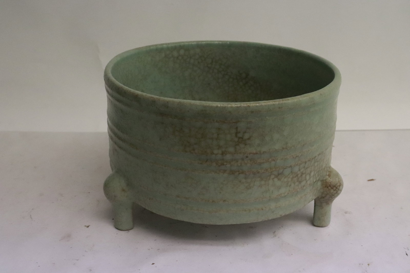A celadon tripod censer: A celadon tripod censer, 4"x6.7"x6.7"