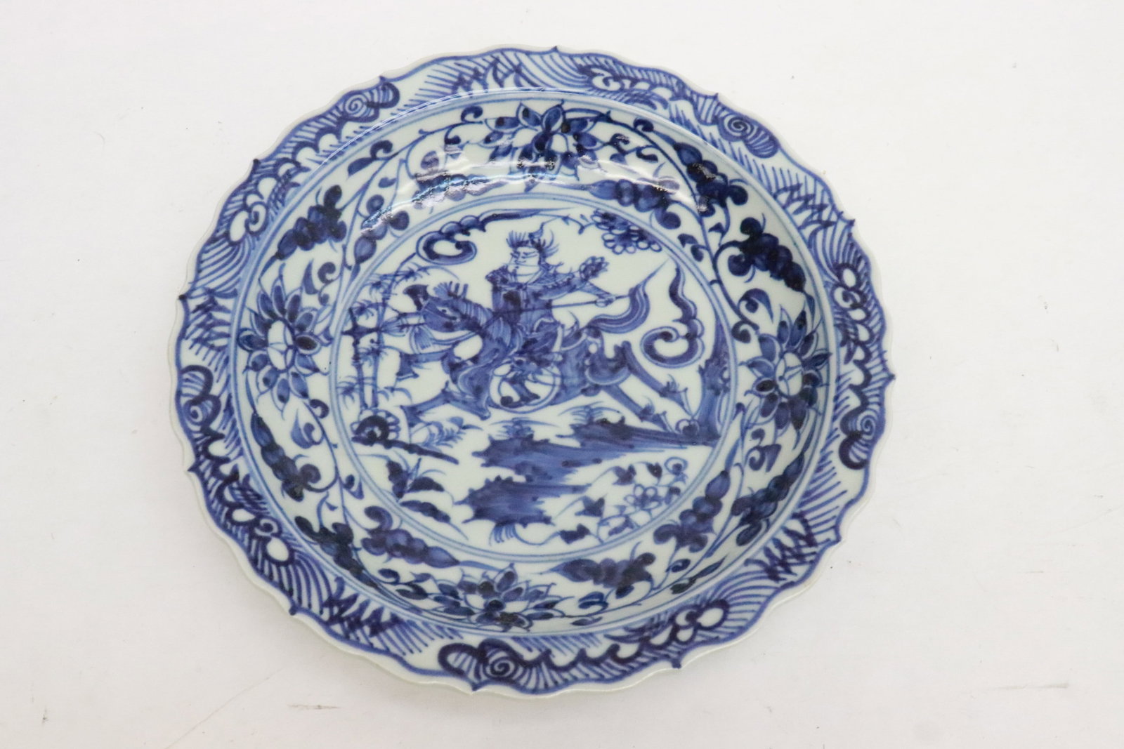 A blue and white porcelain plate: A blue and white porcelain plate, 1.4"x8.6"dia