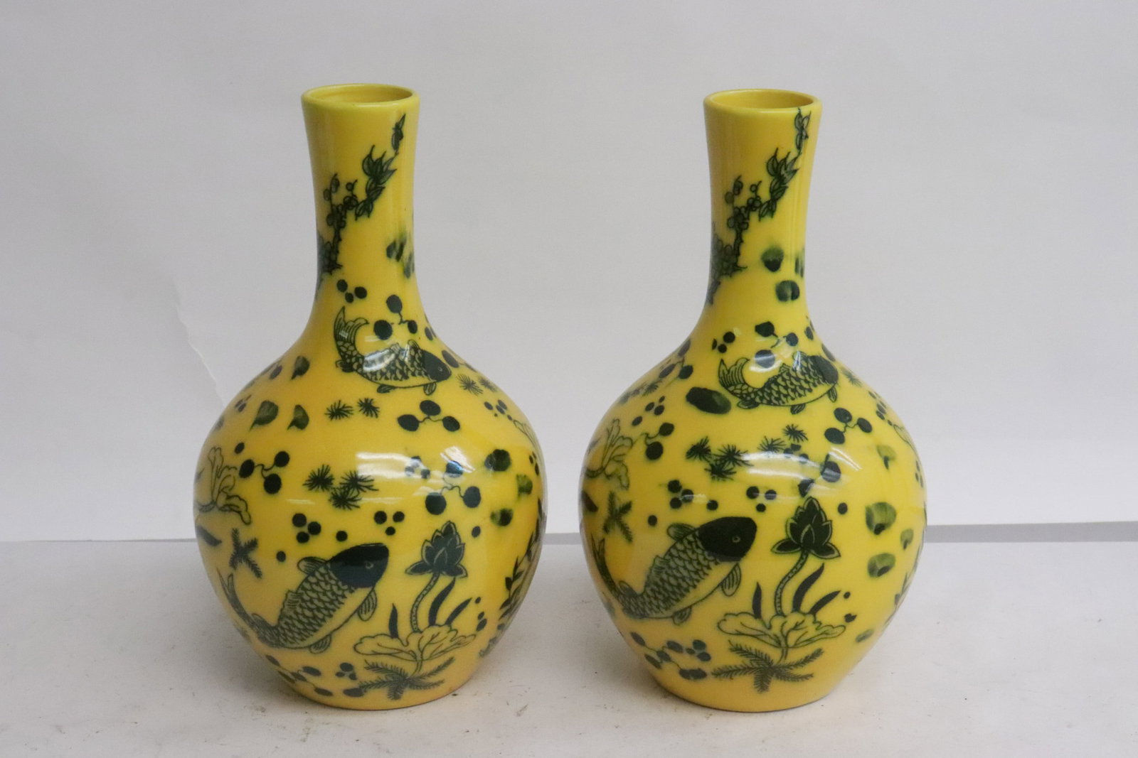 Pair blue and yellow porcelain bottle vase: Pair blue and yellow porcelain bottle vase, 6.7"x3.95"dia ea