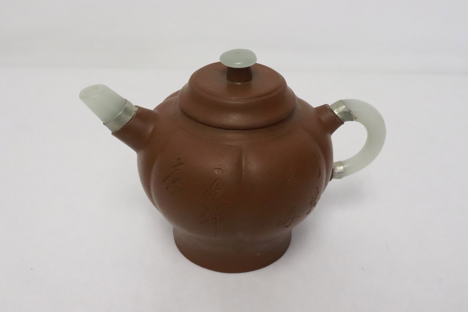 Yixing teapot with jade like spout and handle: Yixing teapot with jade like spout and handle, 4.35"x6.15"x4"
