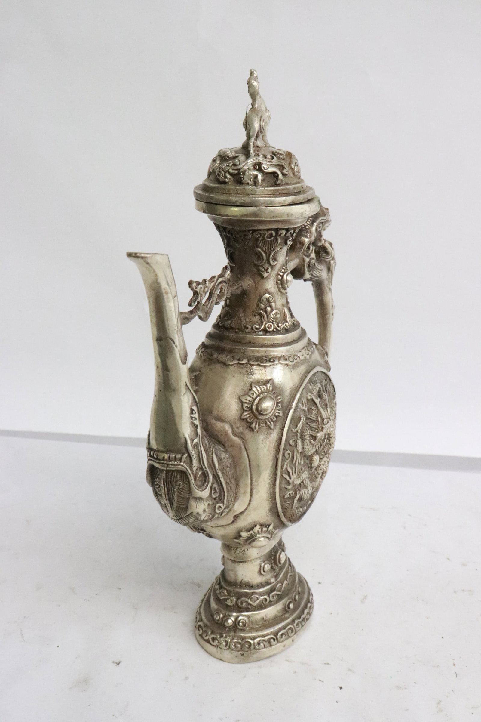 A white bronze wine server - 2