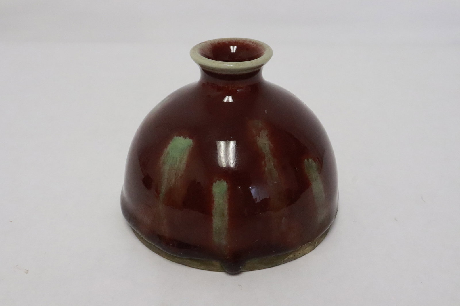 A flambe oxblood water dripper (1 of 5)