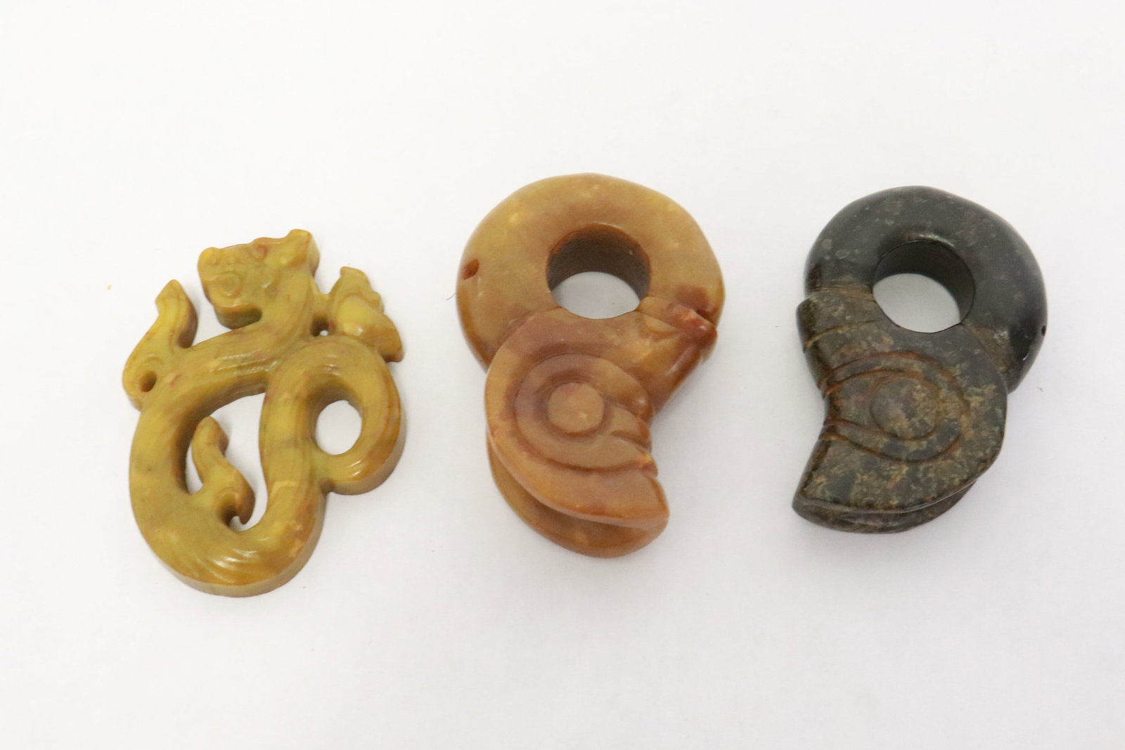 3 jade like carvings: 3 jade like carvings, 3.1"x2"x0.68" - 3.2"x2.25"x1"