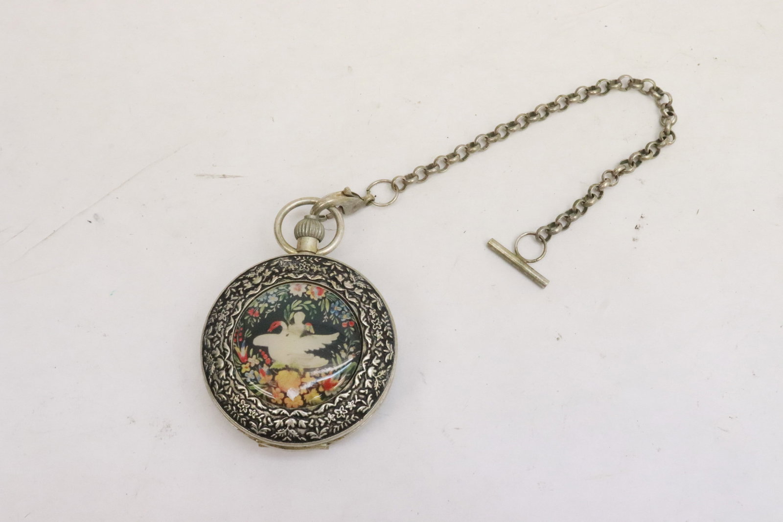 A pocket watch: A pocket watch, 2.9"x2.18"x0.85"