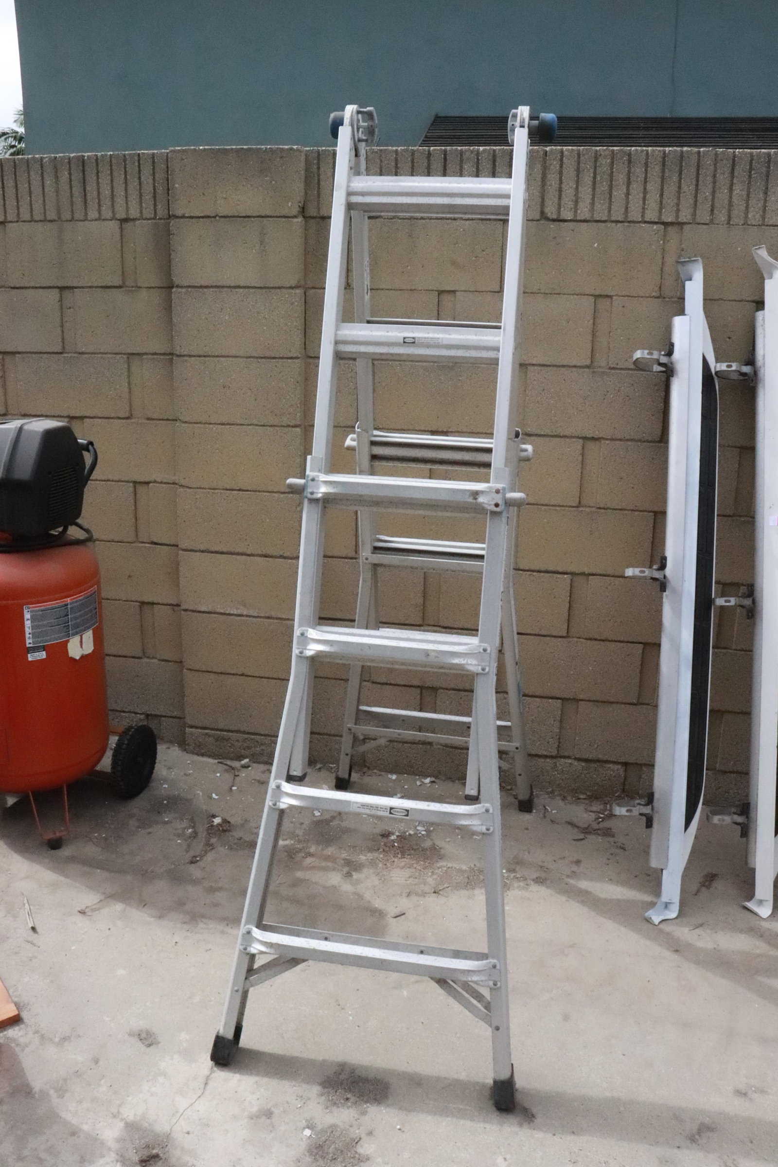 A Werner multi-position ladder: A Werner multi-position ladder, 76"x24"x8.5"