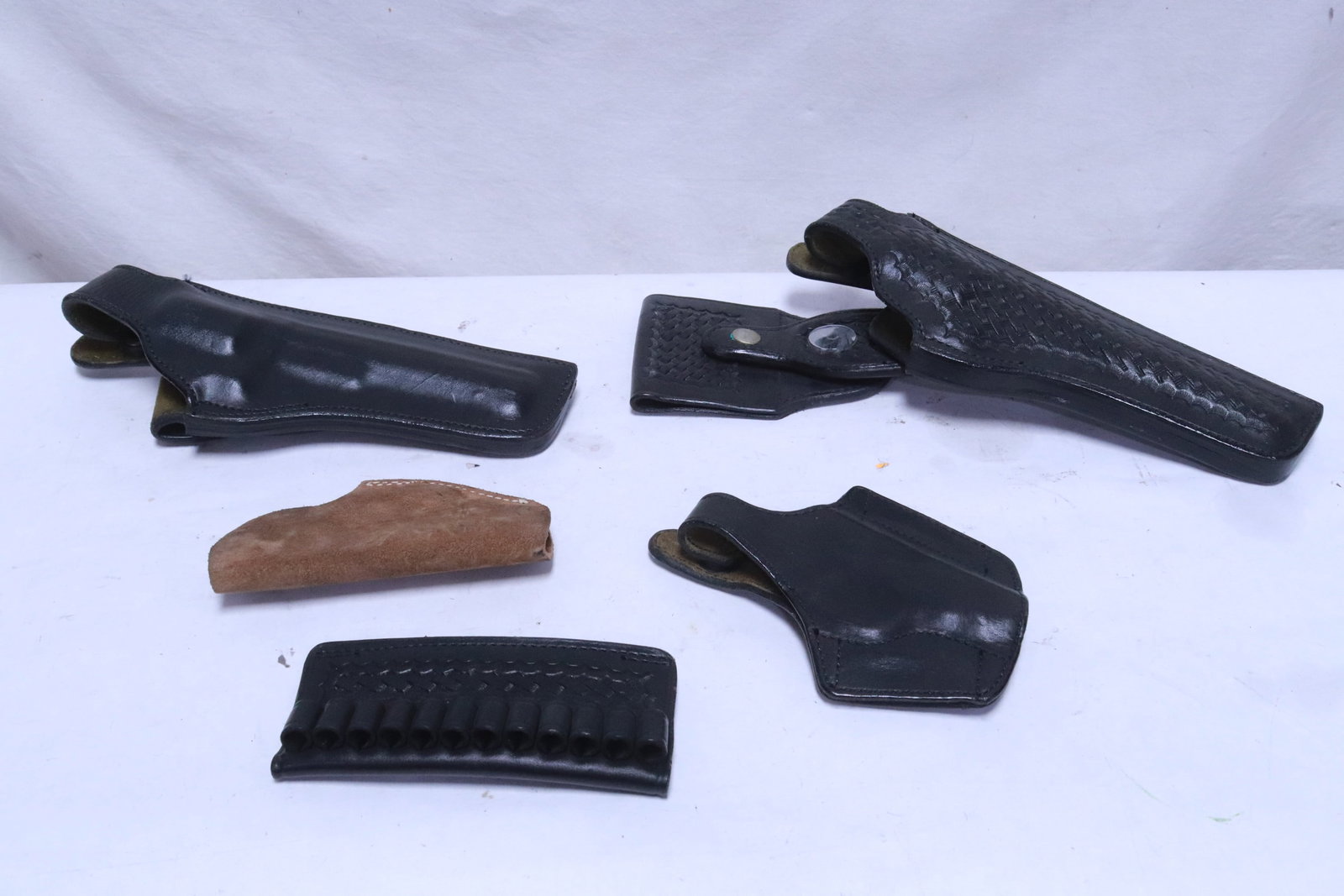 4 leather pistol holsters, & a leather bullet holder (1 of 6)
