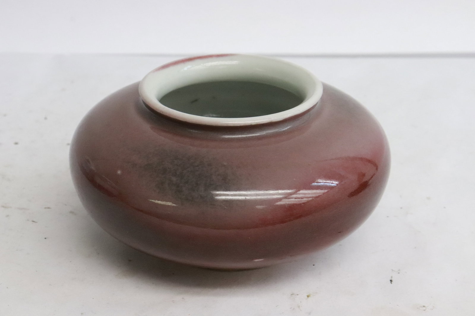 Chinese 17th c. porcelain water dripper, Kangxi period: An important Chinese 17th century red glazed porcelain water dripper, Kangxi period, 2.25"x4.3"dia
