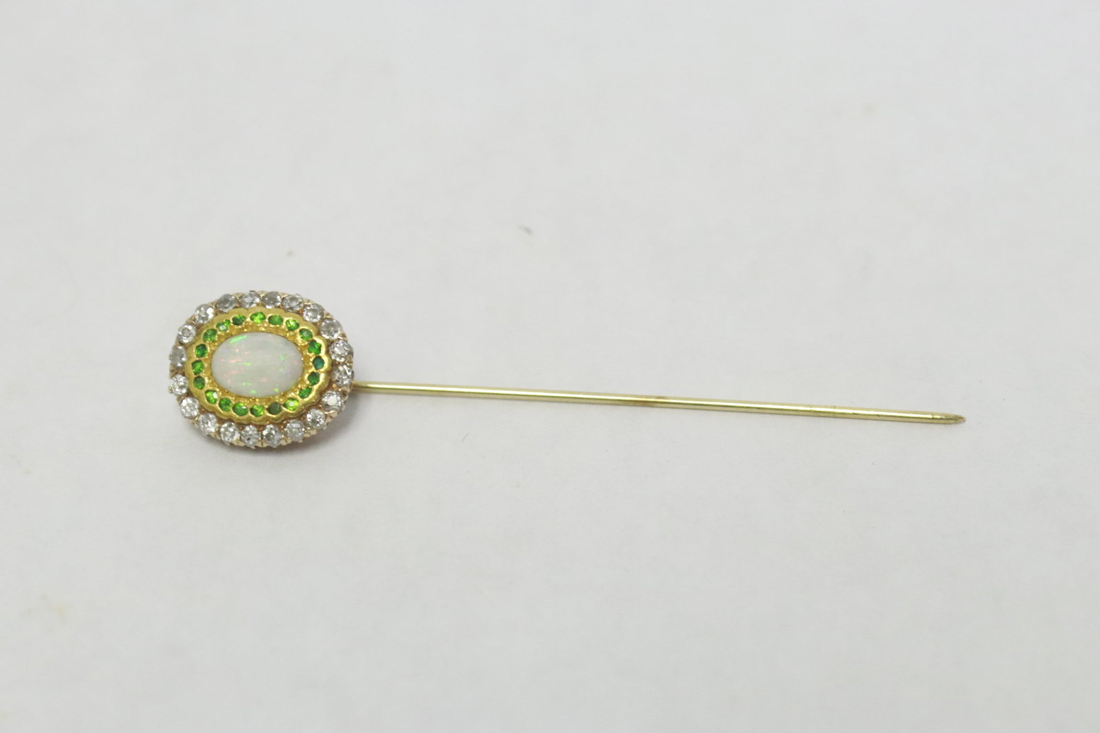 Victorian 14K stick pin w/ opal, diamonds, & green stones: Beautiful Victorian 14K stick pin (2.6"L) with center opal (0.35"x0.25"0, accented with 20 old cut diamonds, and 20 green stones (possible garnet), wt. 3.2gm