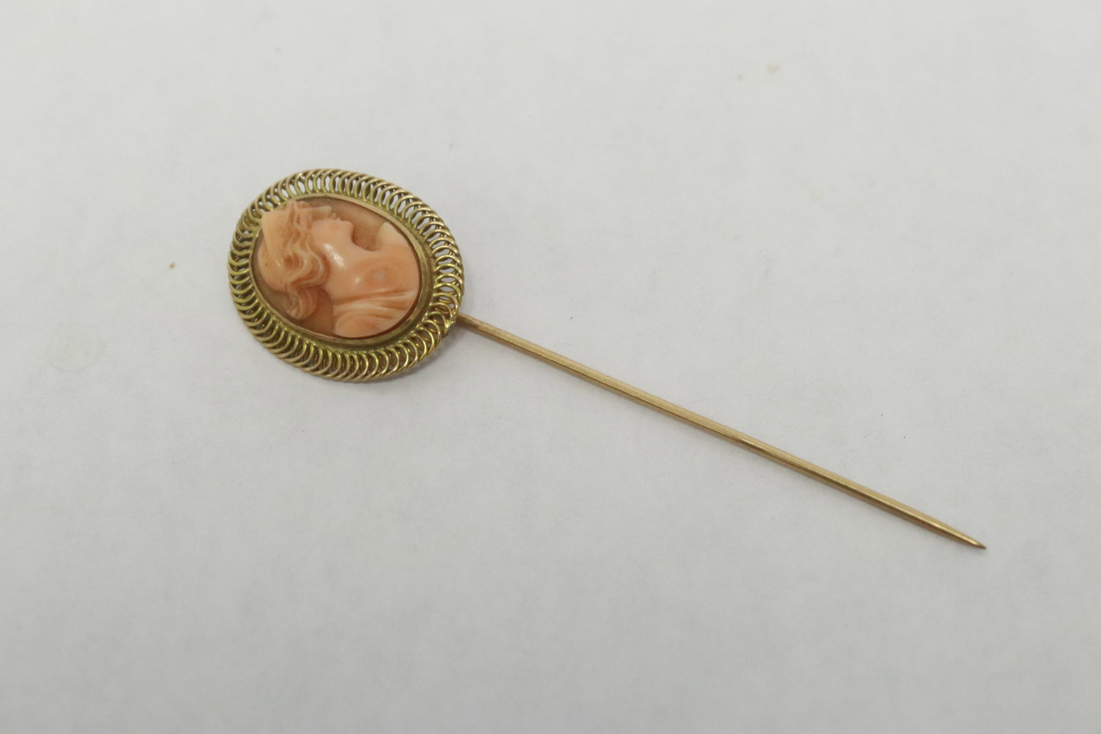 14K Y/G stick pin w/ coral carved cameo: Beautiful 14K Y/G stick pin (2.75"L) with coral carved cameo (0.63"x0.5"0, wt. 3.1gm, NO INTERNATIONALSHIPPING OF CORAL