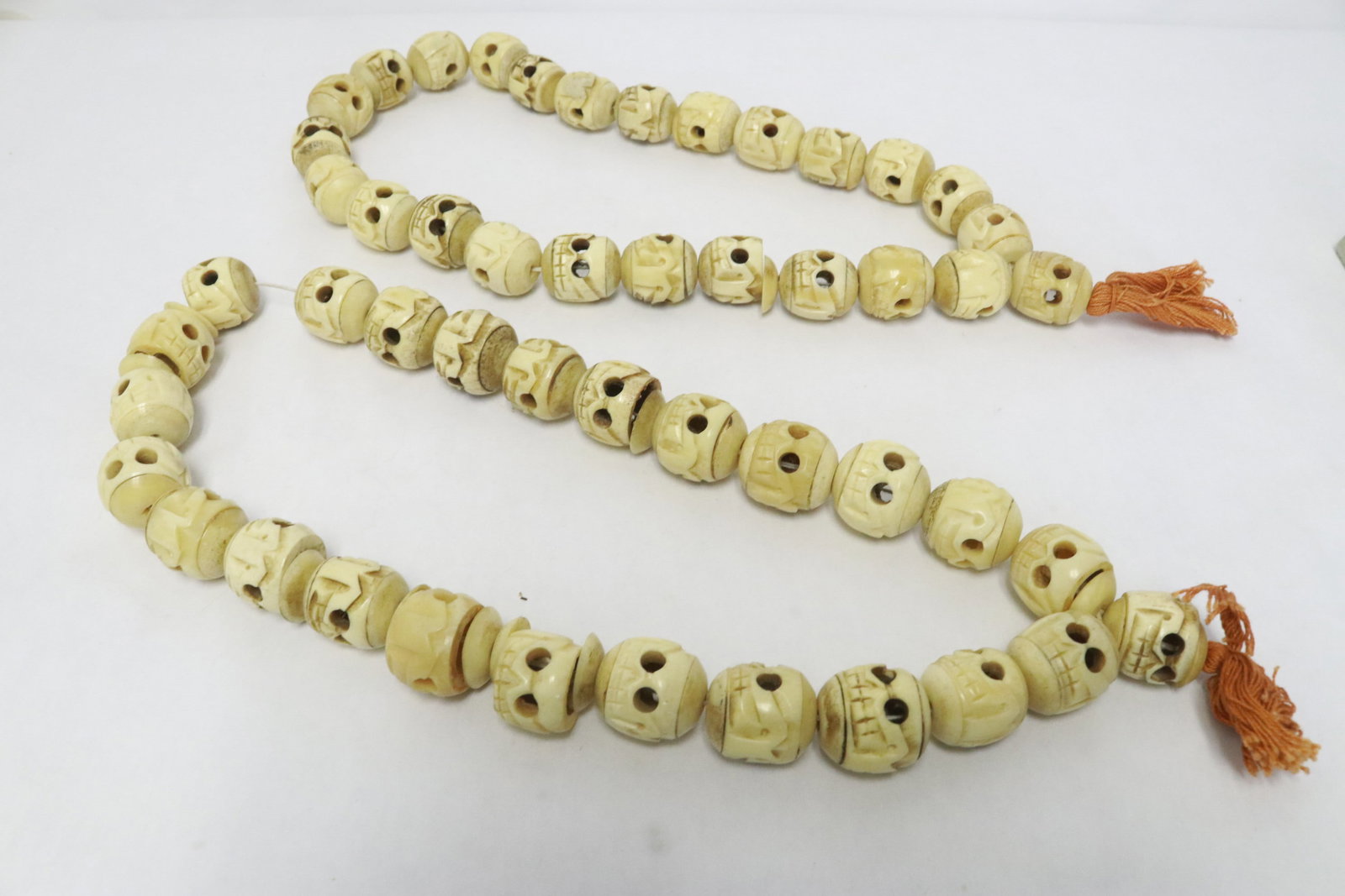2 bone carved necklaces w/ large skull motif links (1 of 7)