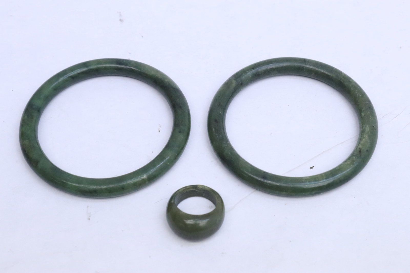 2 Chinese spinach jade bangles, and a bangle ring: 2 Chinese spinach jade bangles (0.35"X3.1" dia ea), and a bangle ring (size 7.5)