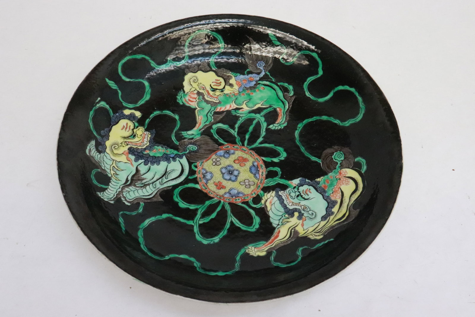 A black background famille rose porcelain plate: A beautiful black background famille rose porcelain plate, 1.95"x11.25"dia