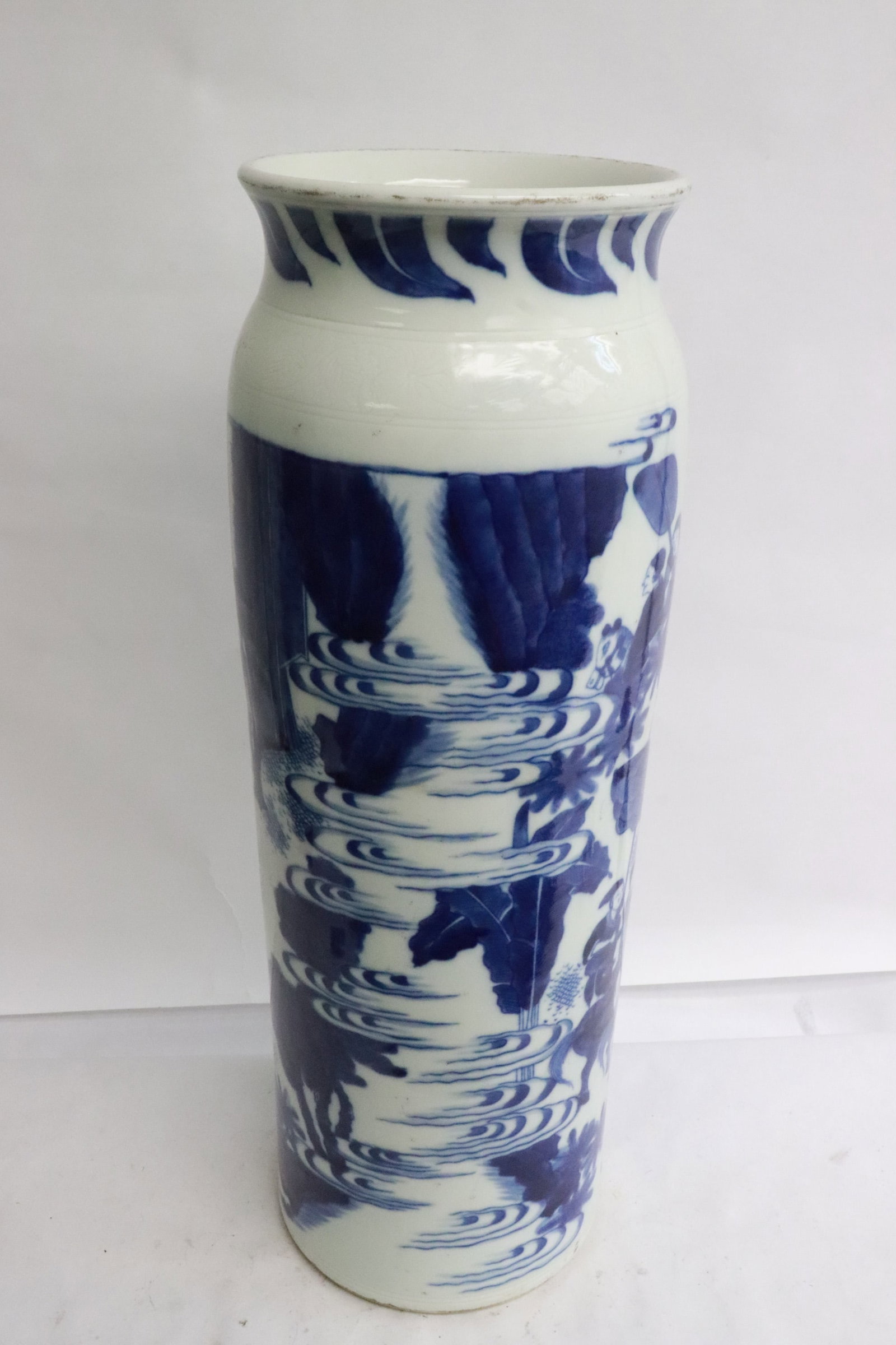 A tall Chinese blue and white porcelain vase: A tall Chinese blue and white porcelain vase, 18.3"x6.65"dia