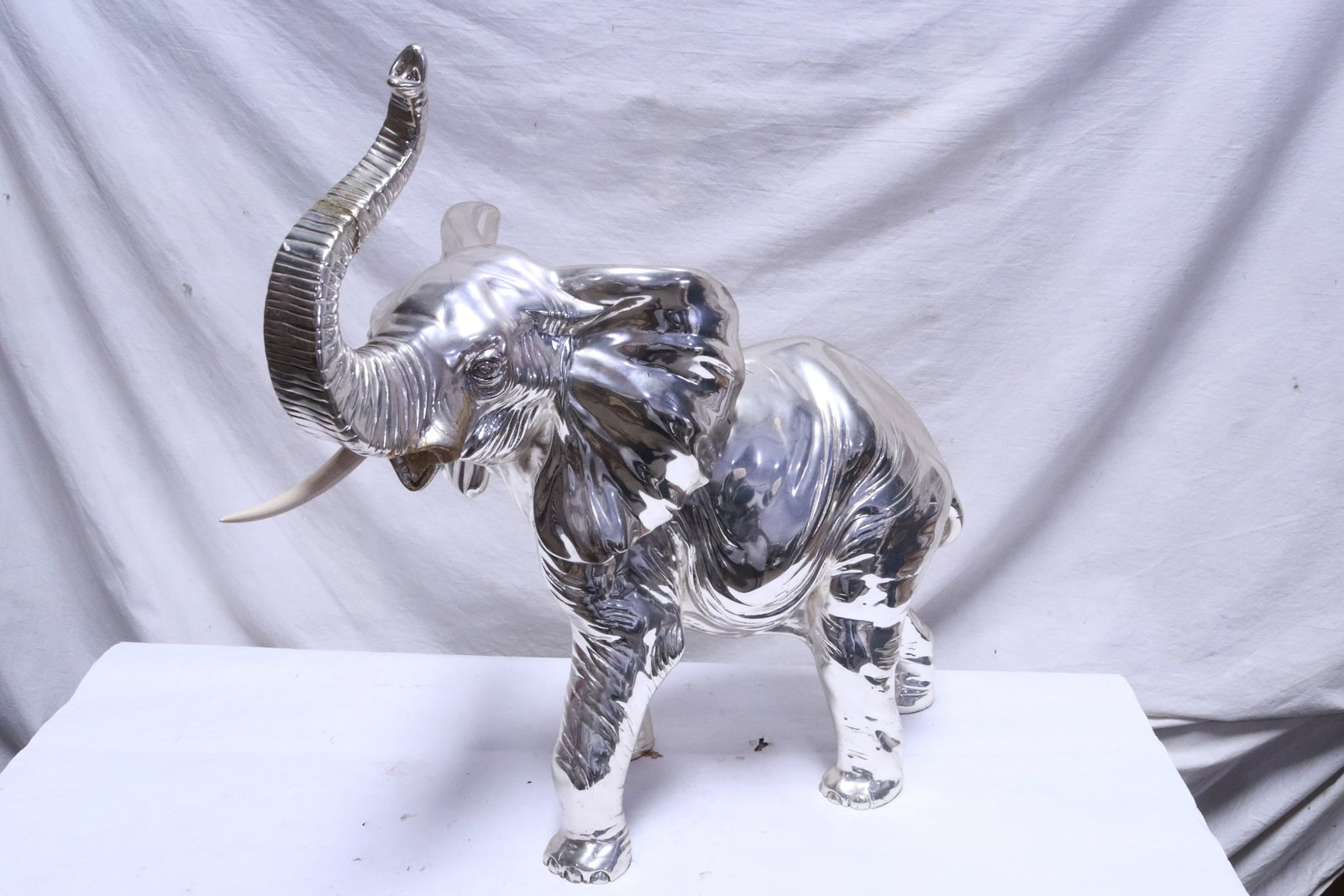A large silver overlay elephant: A large silver overlay elephant, one trunk missing, 21.5"H