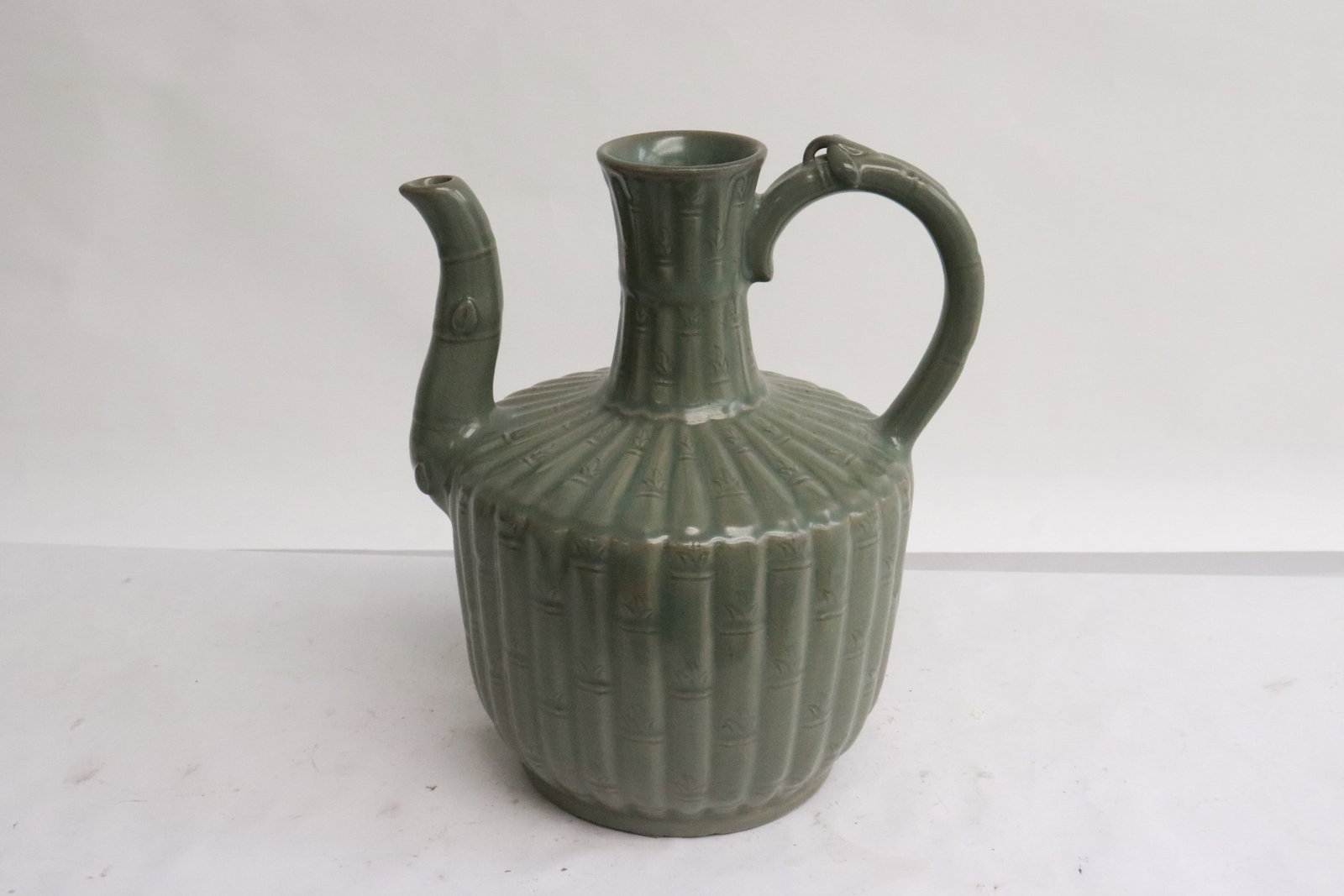 A celadon wine server: A celadon wine server, 8.2"x6.8"x5.8"
