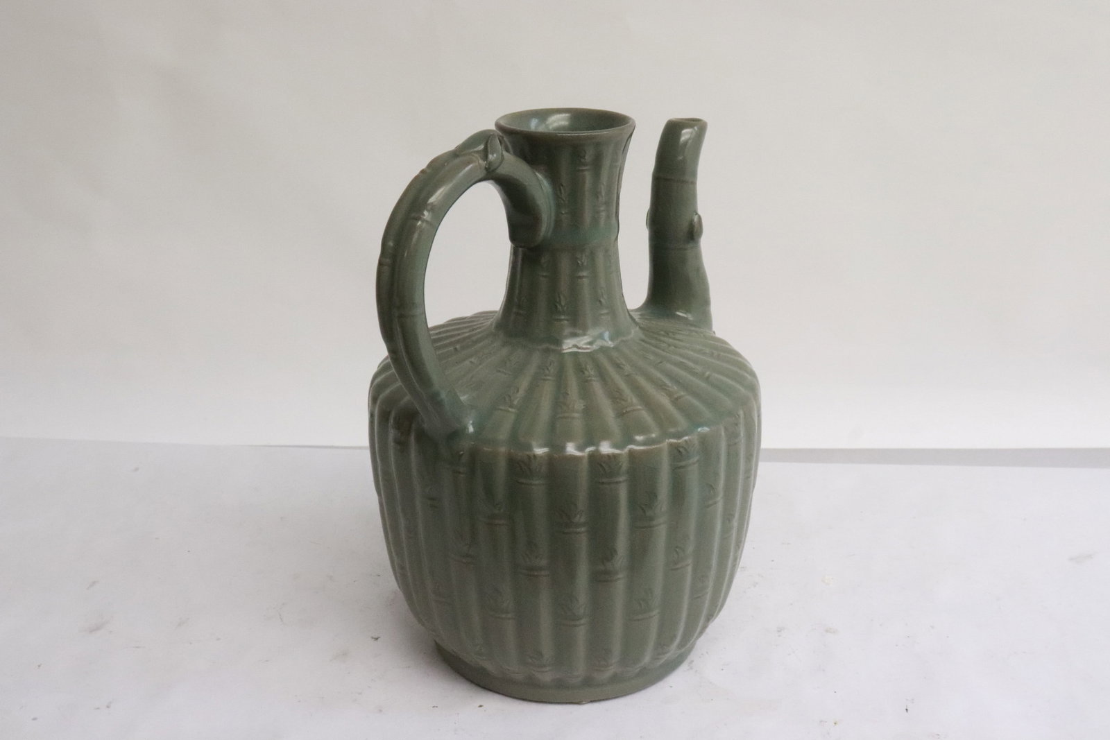 A celadon wine server - 3
