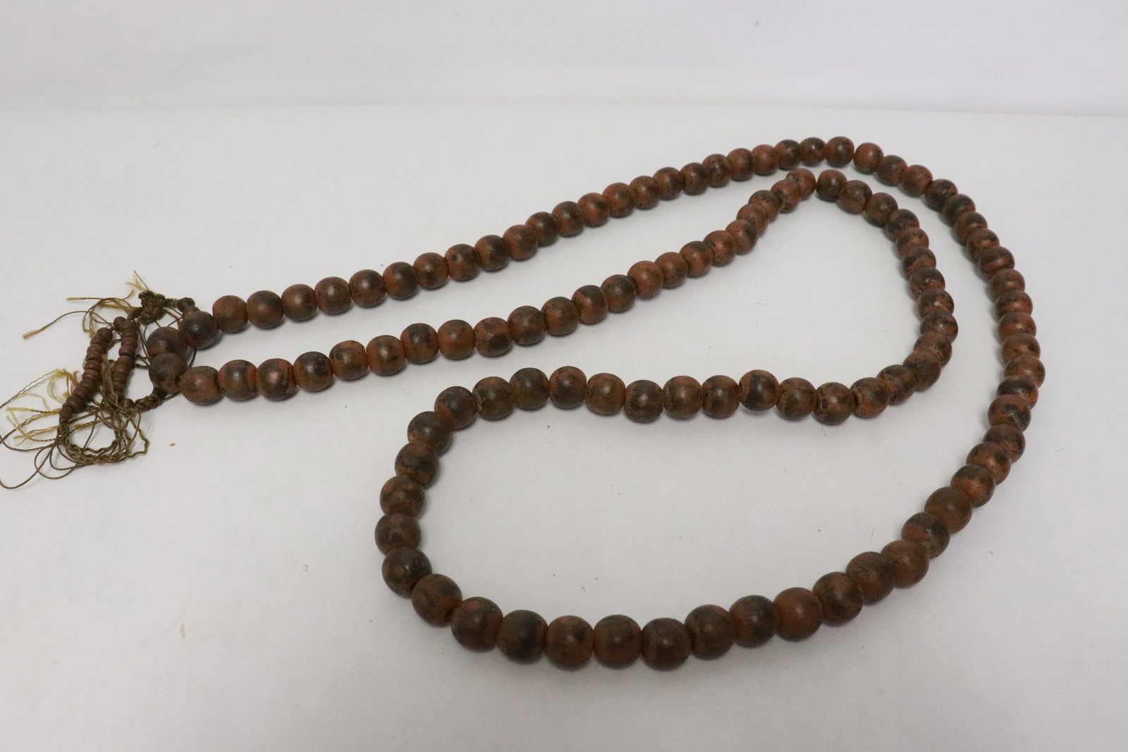 A wood bead necklace: A wood bead (0.5"x0.55"dia ea) necklace (59"L)