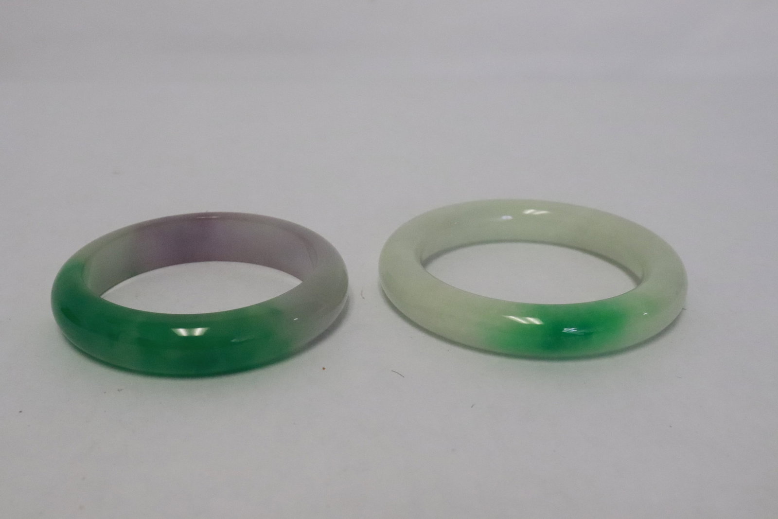 2 jadeite like bangles: 2 jadeite like bangles, 0.55"x3"dia, 0.5"x3.25"dia