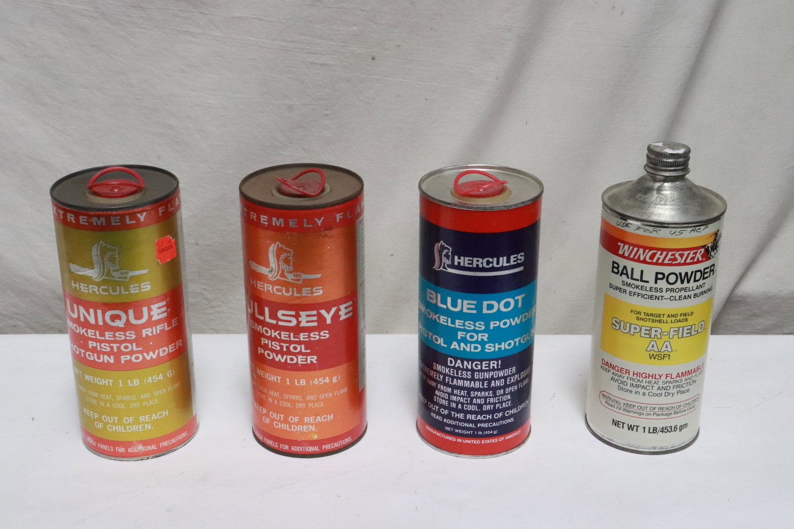 4 bottles: 4 bottles; 3 one lb Hercules pistol/ shotgun powder, one Winchester one lb ball powder, all about 60% full, NO shipping on this lot, local pickup only
