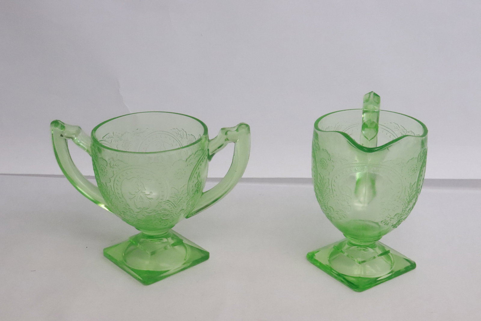 2 rare Uranian glass creamer and sugar: 2 rare Uranian glass creamer and sugar, creamer hairline, 4.25"x5.35"x3.15", 4.5"x4.7"x3.1"