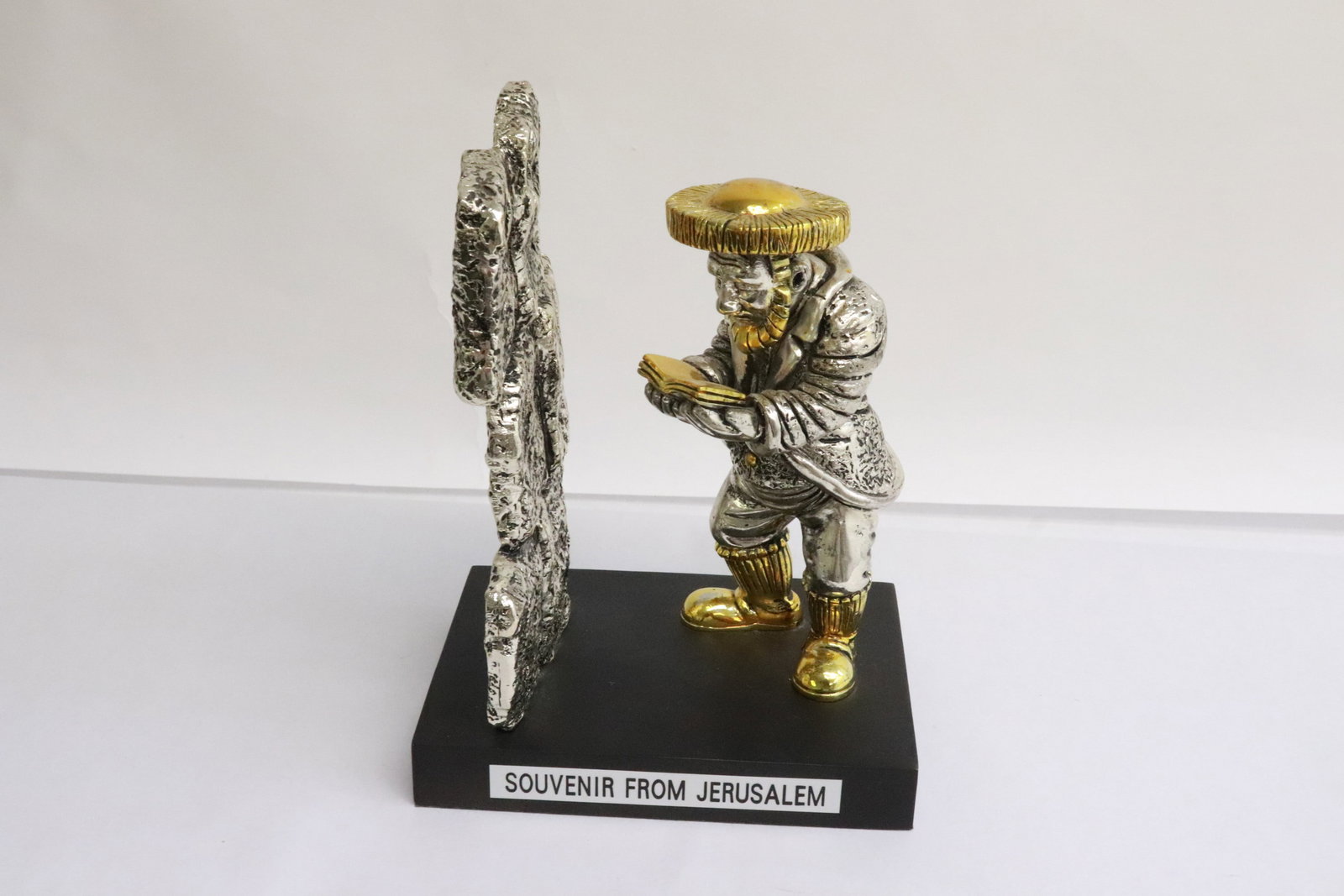 A large sterling art depicting a man reading book: A large sterling art depicting a man reading book, attributed to Frank Meisler (1929-2018), 7"H