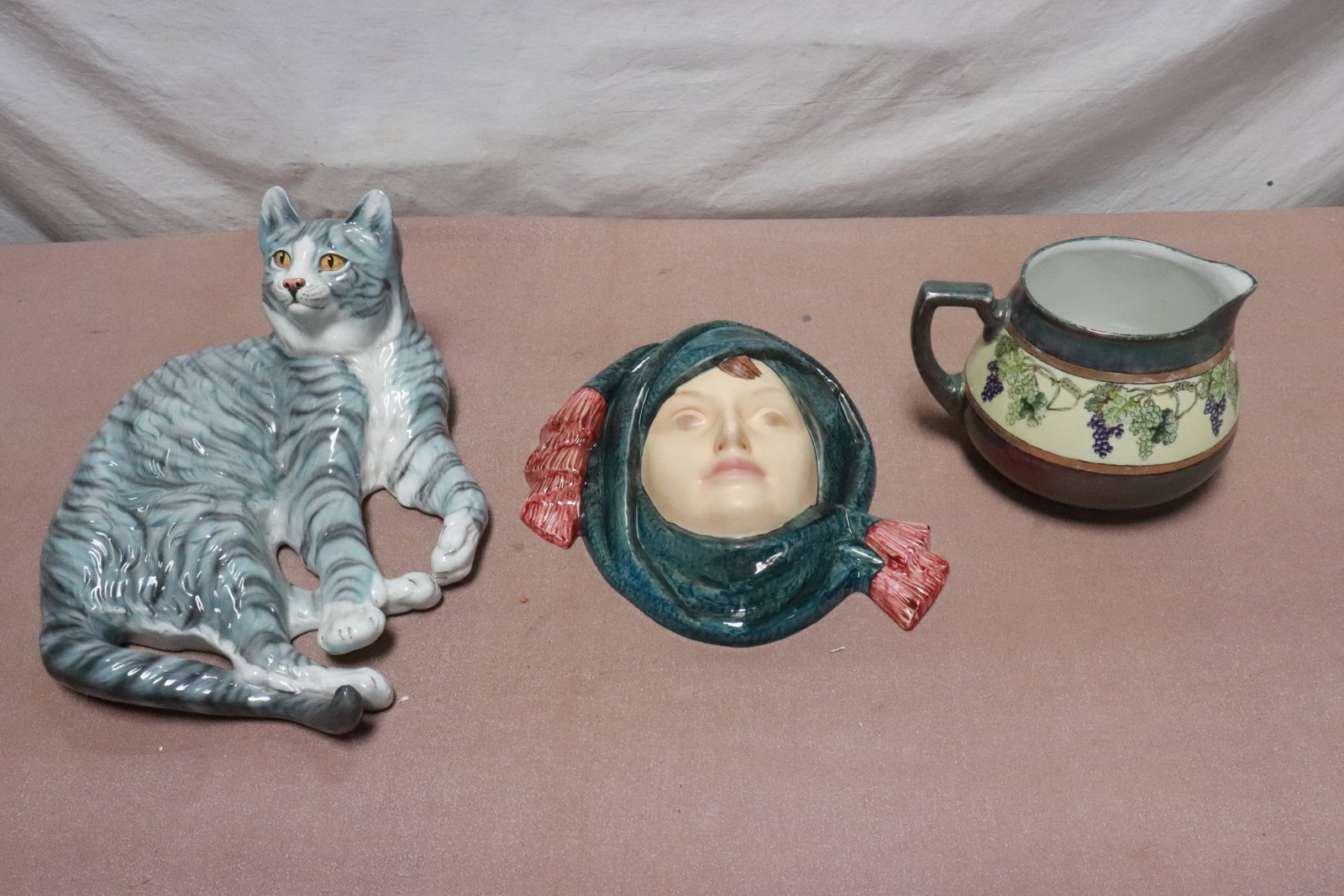 3 pieces: 3 pieces; a large Limoge jag (6.3"x9.7"x7.5"), a very large Goebel porcelain mask (4.2"x11.3"x12.5"), and a massive porcelain cat (6.5"x16"x12.2")