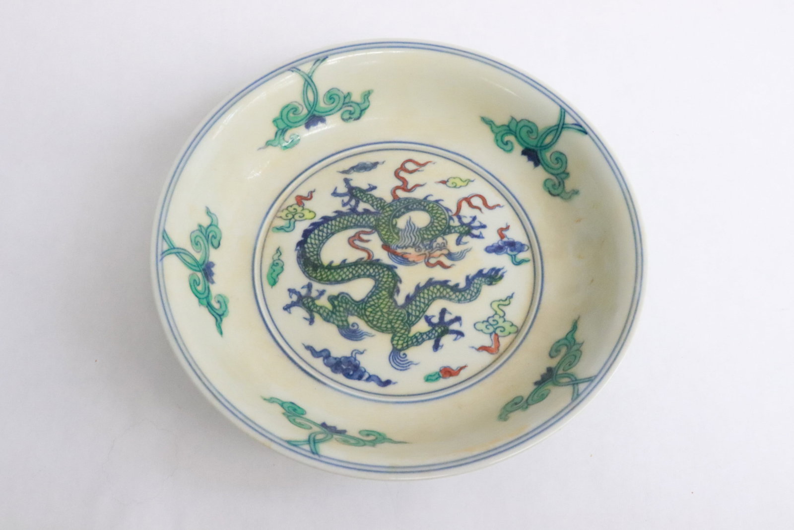 A wucai porcelain plate: A wucai porcelain plate, 1.6"x6.5"dia