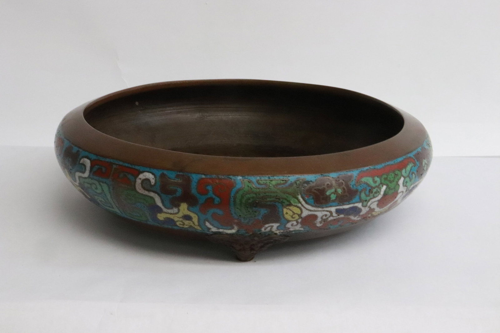 A heavy bronze based cloisonne tripod censer: A heavy bronze based cloisonne tripod censer, 2.7"x10"dia