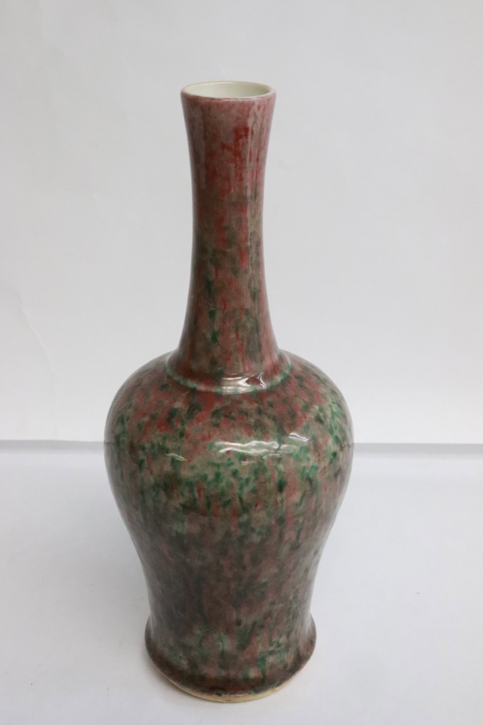A flambe' porcelain vase: A flambe' porcelain vase, 9.2"x3.8"dia
