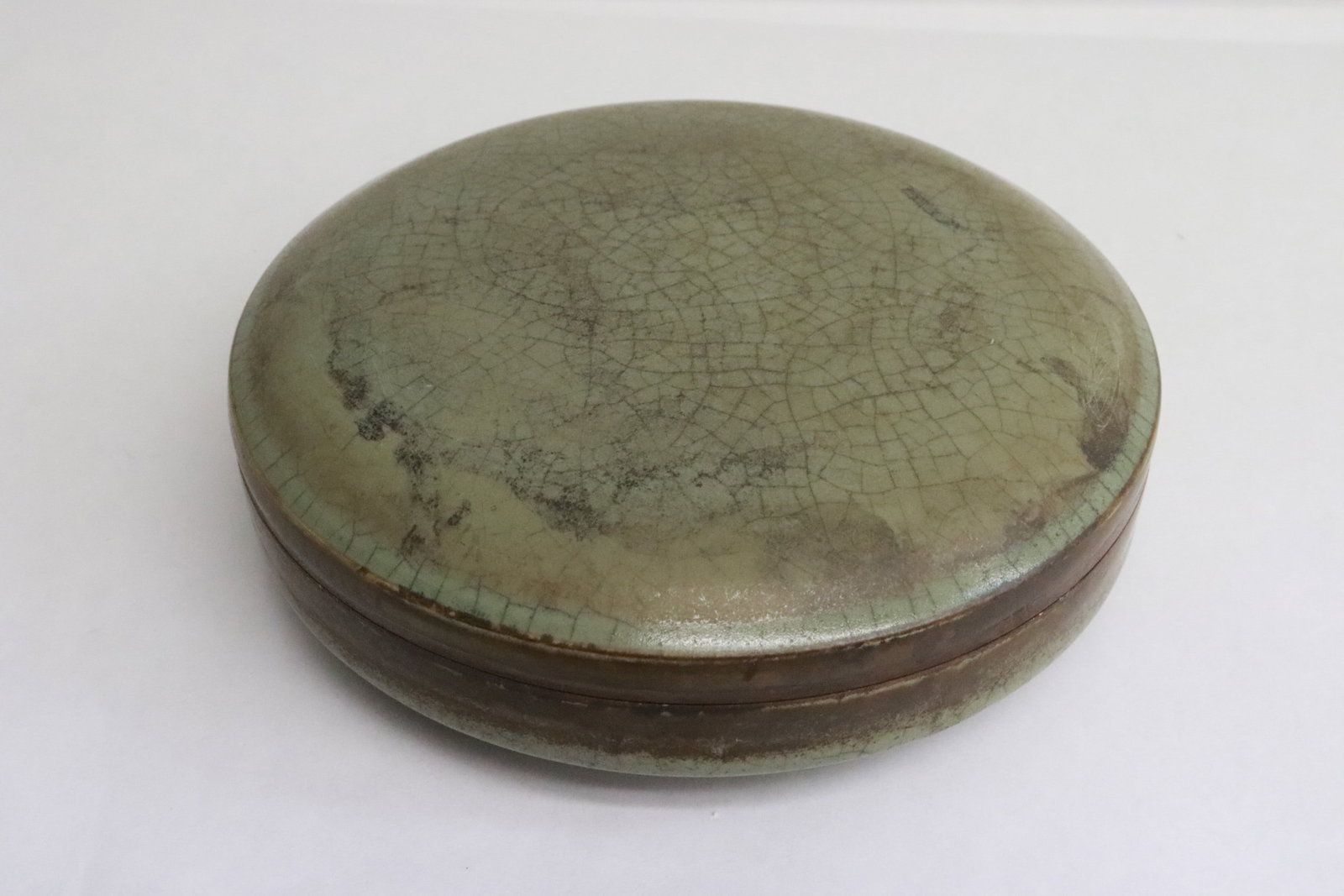 A vintage celadon crackleware box: A vintage celadon crackleware box, 2.25"x6.15"dia