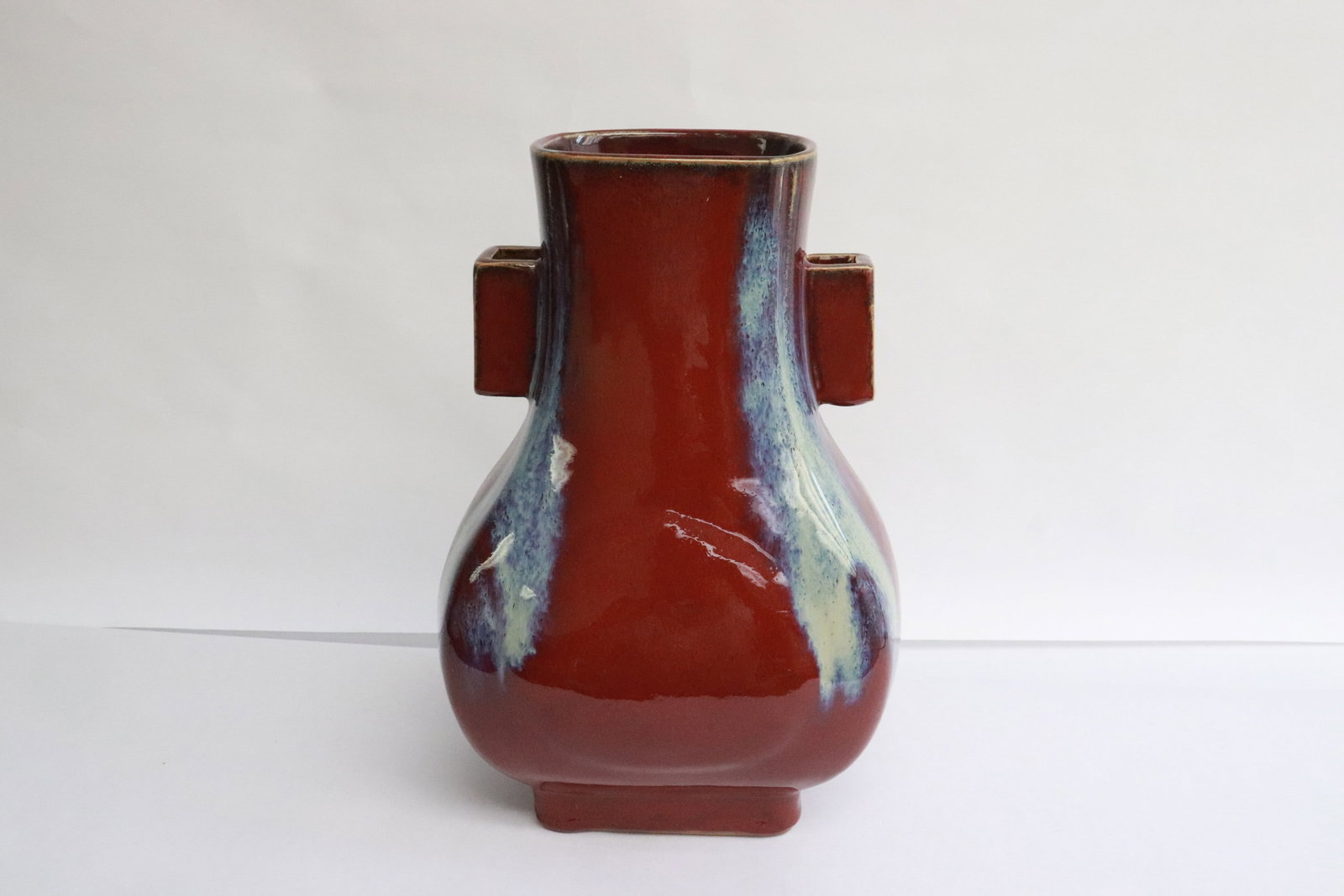 A flambe' porcelain jar: A flambe' porcelain jar, 10.75"x7.35"x6.2"
