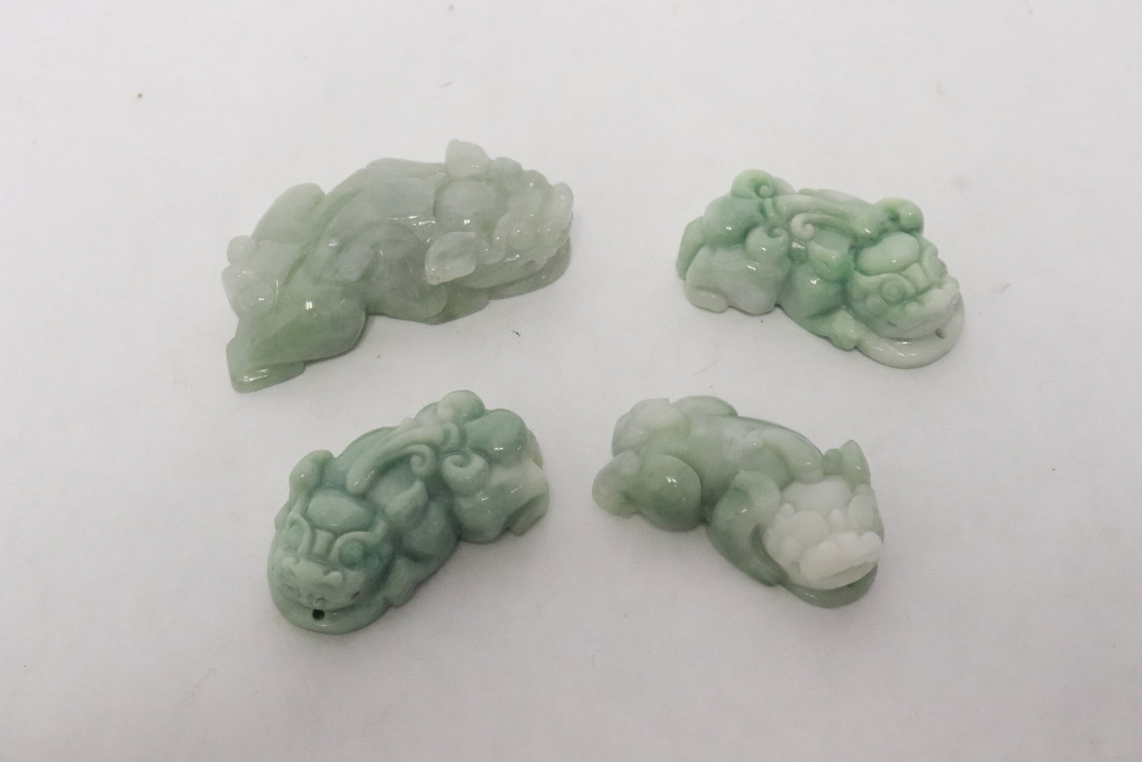 4 Chinese natural color jadeite carved animals: 4 Chinese fine natural color jadeite carved animals, 0.65"x1.6"x0.85" - 0.65"x2.3"x1.18"