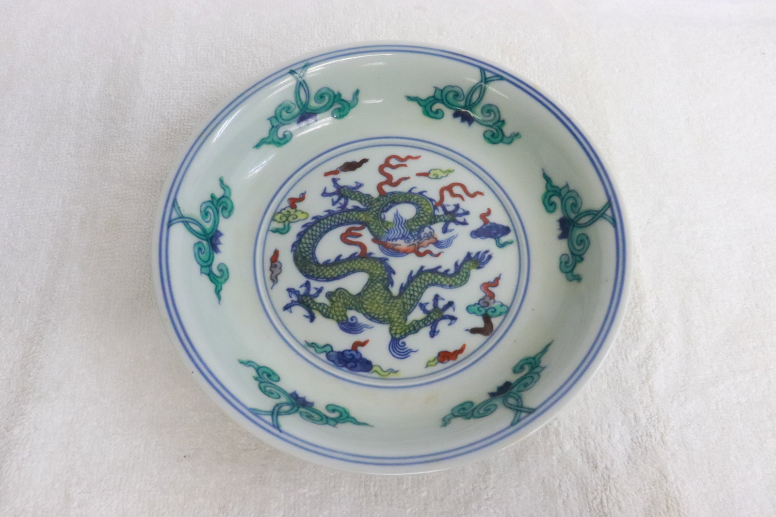 A wucai porcelain plate: A wucai porcelain plate, 1.6"x6.6"dia